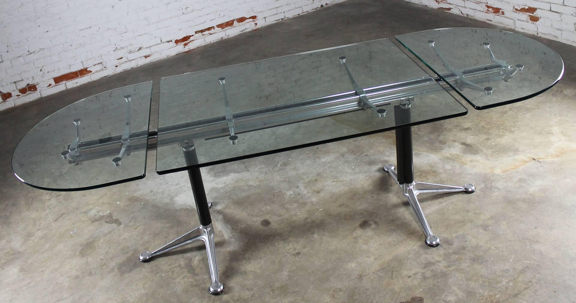 Beautiful and beautifully made Burdick Group beam table by Herman Miller with three-piece oval glass top and double pedestal base. This table, or desk, is in wonderful vintage condition. There may be some scratching to the glass but no other