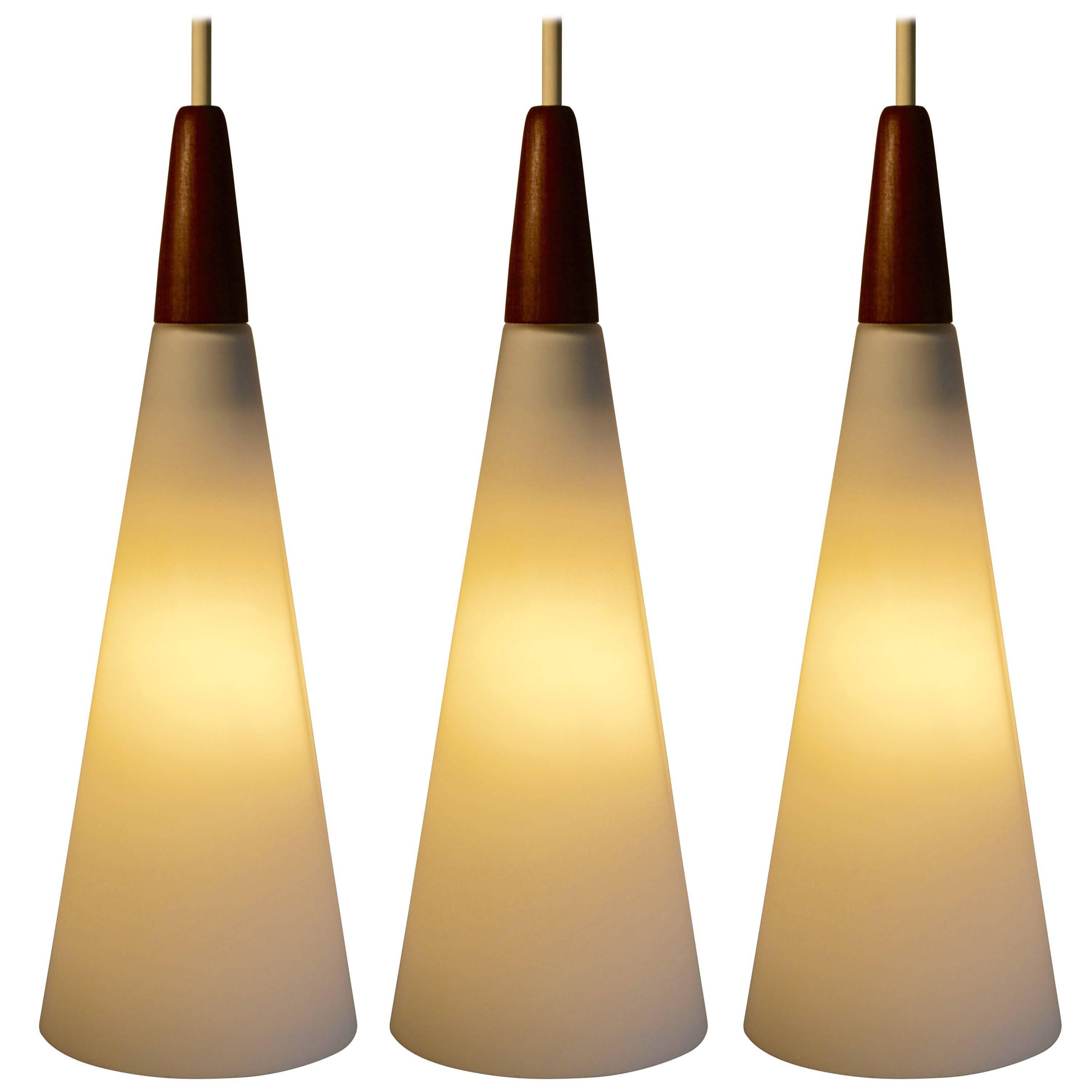 Three Mid Century White Satin Glass and Teak Pendant Lights, Finland, 1960's For Sale