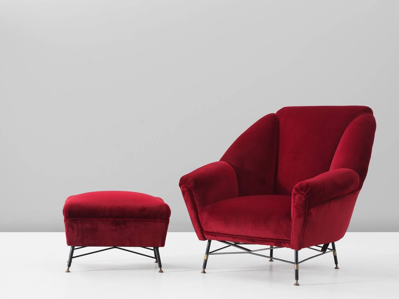 Lounge chair and footstool in fabric and metal, Italy, 1950s.

Lounge chair with accompanying hocker. Designed and made in Italy in the style of Augusto Bozzi. Elegant organic shaped easy chair in red velvet upholstery, made with nicely shaped black