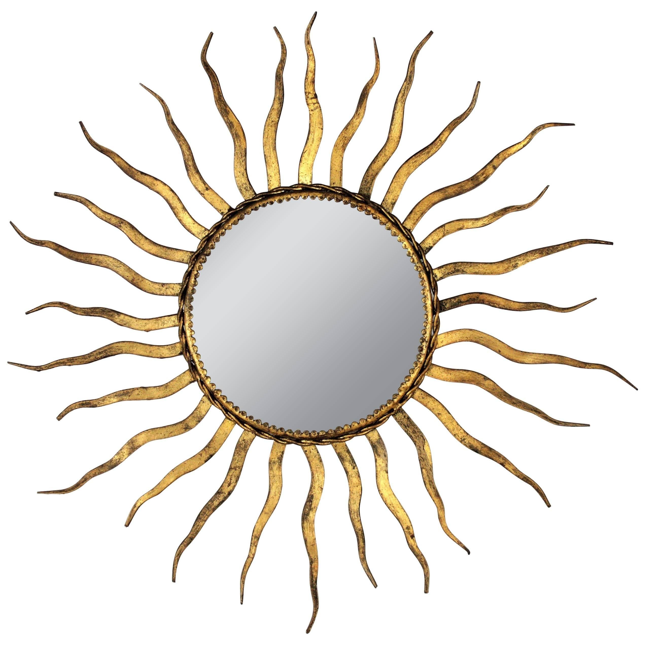 French 1950s Wrought Gilt Iron Sunburst Mirror in the Style of Gilbert Poillerat