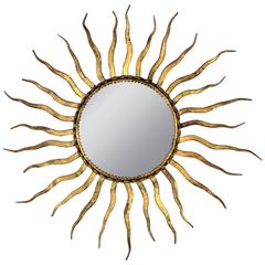 French 1950s Wrought Gilt Iron Sunburst Mirror in the Style of Gilbert Poillerat