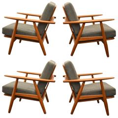 Huge Set of 4 1960 Hans Wegner Armchairs and One Ottoman for GETAMA Huge Set of 4 1960 Hans Wegner Armchairs and One Ottoman for GETAMA