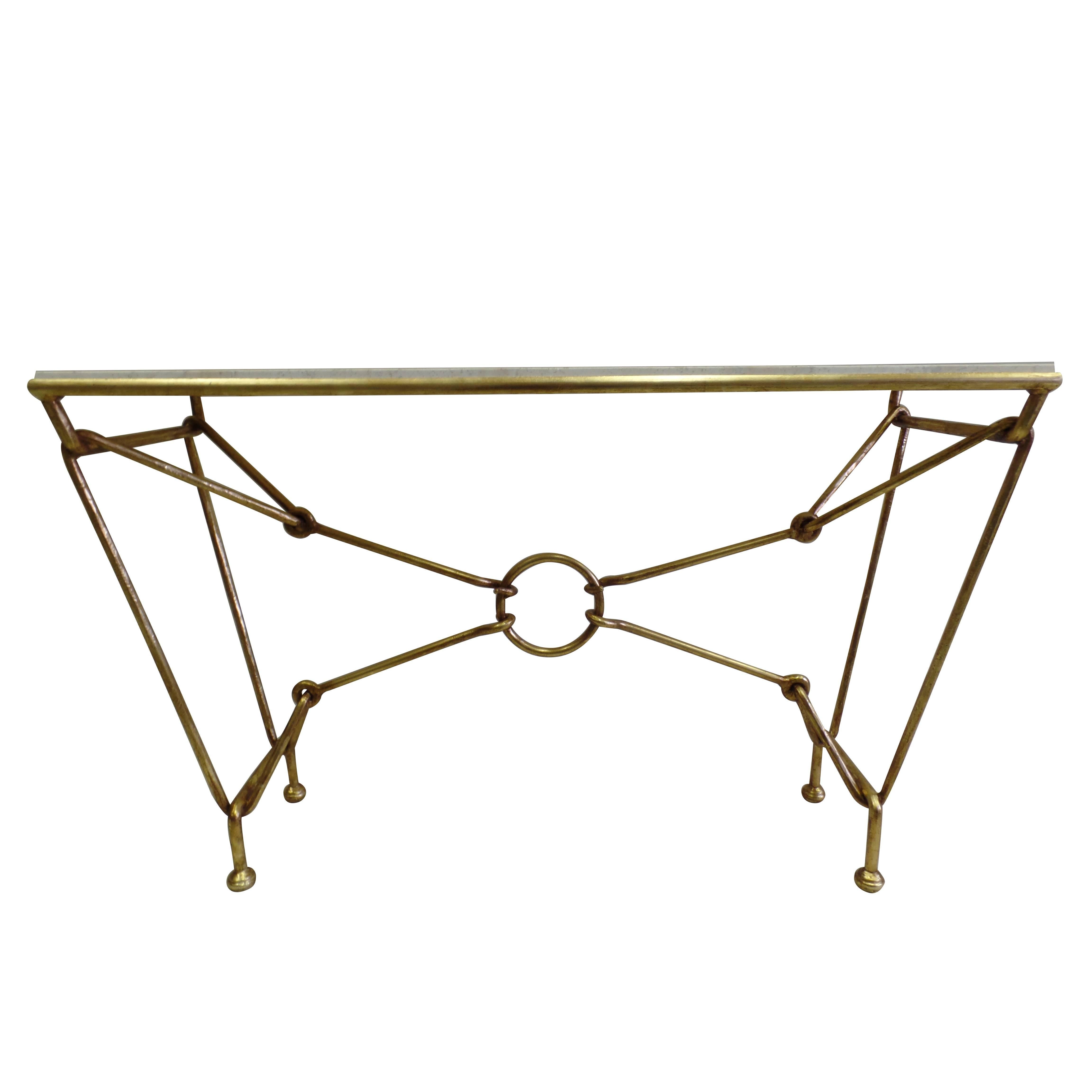 Italian Mid-Century, hand-wrought gilt iron console or sofa table by the Florentine sculptor / designer, Giovanni Banci in the modern neoclassical spirit. 

The table has bold lines with the gilt iron frame simulating a Classic Hermes pattern