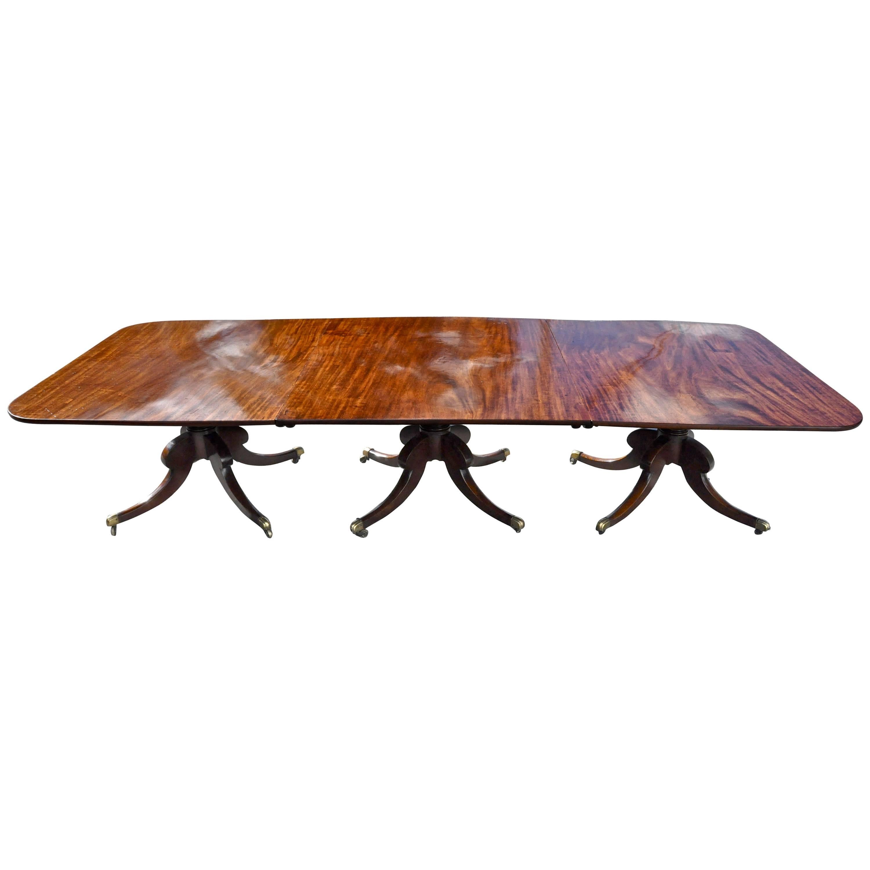 Period three pedestal regency mahogany dining table. 

Three pedestal dining table in three sections. All original and one board top sections. Well figured cuban mahogany. Original pedestals to bases and original hardware. Good early finish and
