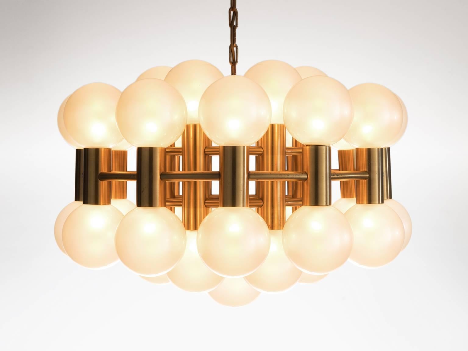 Chandelier, glass and metal, attributed to Motoko Ishii for Staff, Germany, 1970s. 

This chandelier spreads the light of the large amount of 37 spheres, divided over two levels. The metal frame is nice brass-gold colored, which beautifully combines