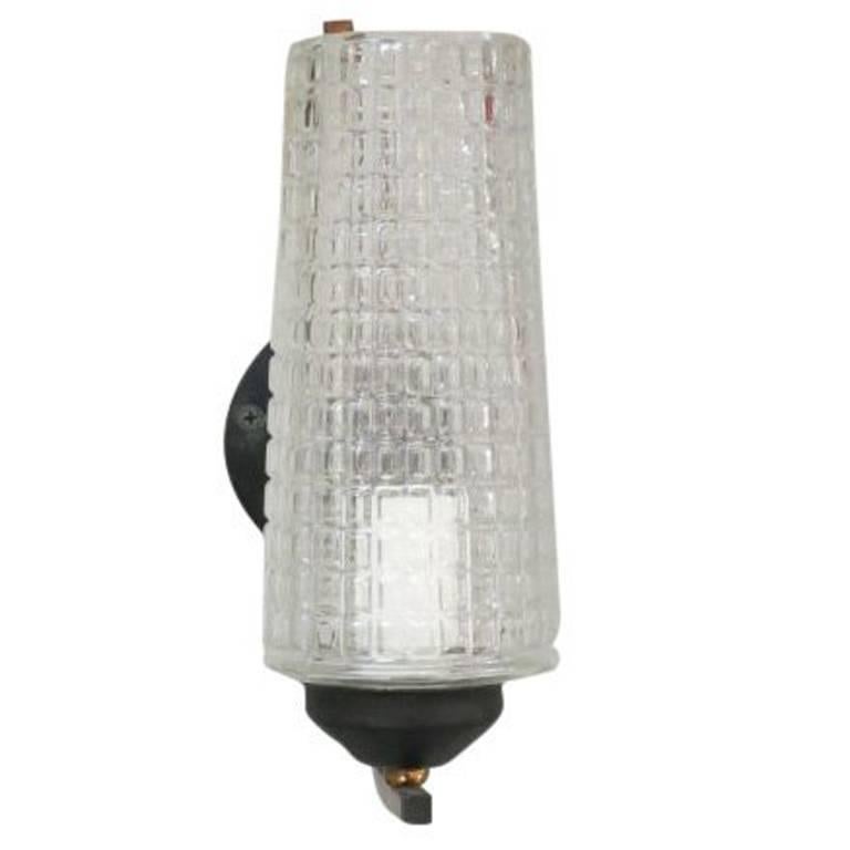 Vintage Italian wall lights with clear Murano glass hand blown into a cylinder shape with textured square patterns, mounted on black metal brackets / Designed by Stilnovo, circa 1940’s / Made in Italy
1 light / E12 or E14 type / max 40W
Height: 9