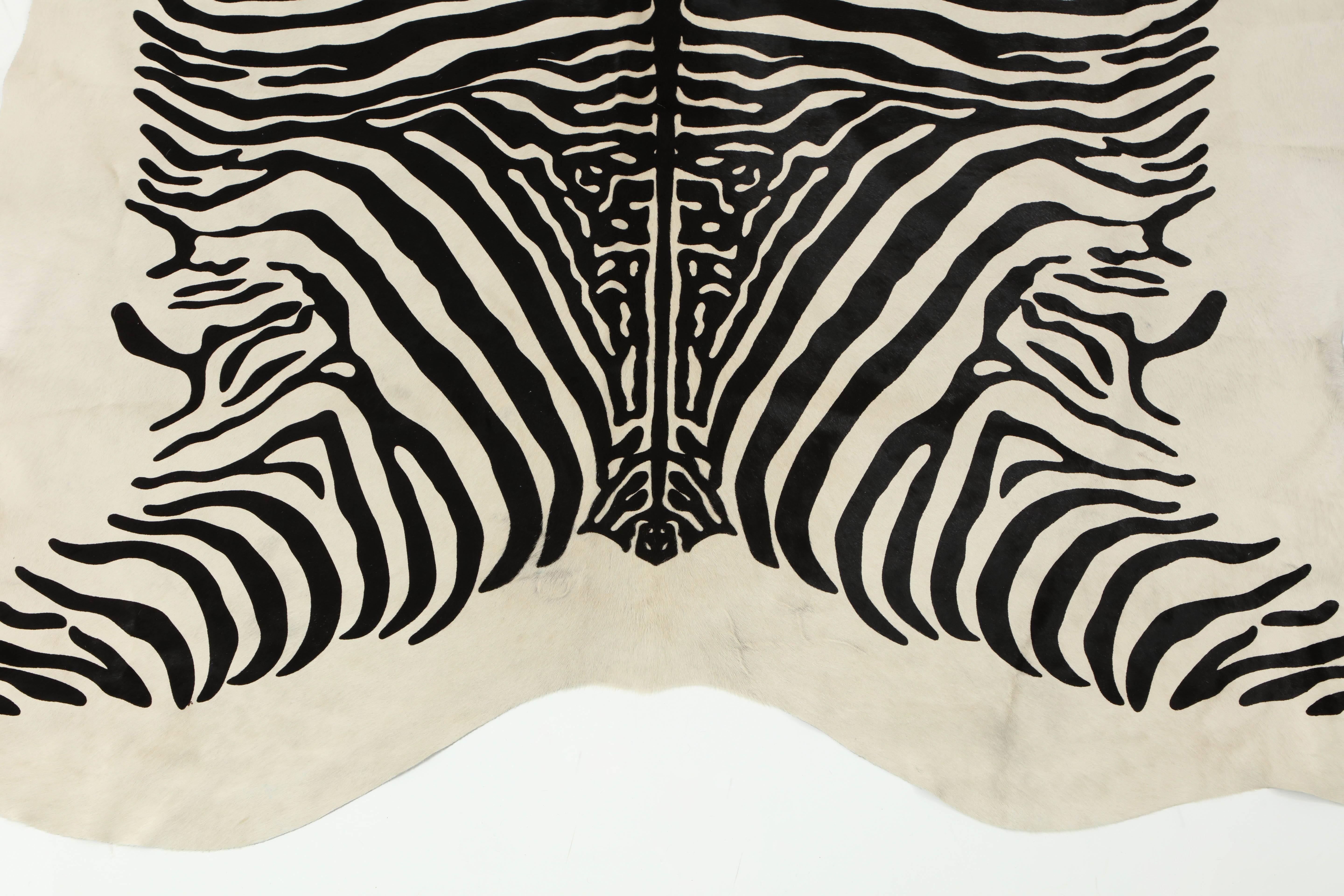 This contemporary stenciled zebra print Brazilian cowhide rug is made of 100% natural materials. Their tanneries are ISO-9001 certified for quality and ISO 14001 certified for low environmental impact which is what gives them their gold star rating