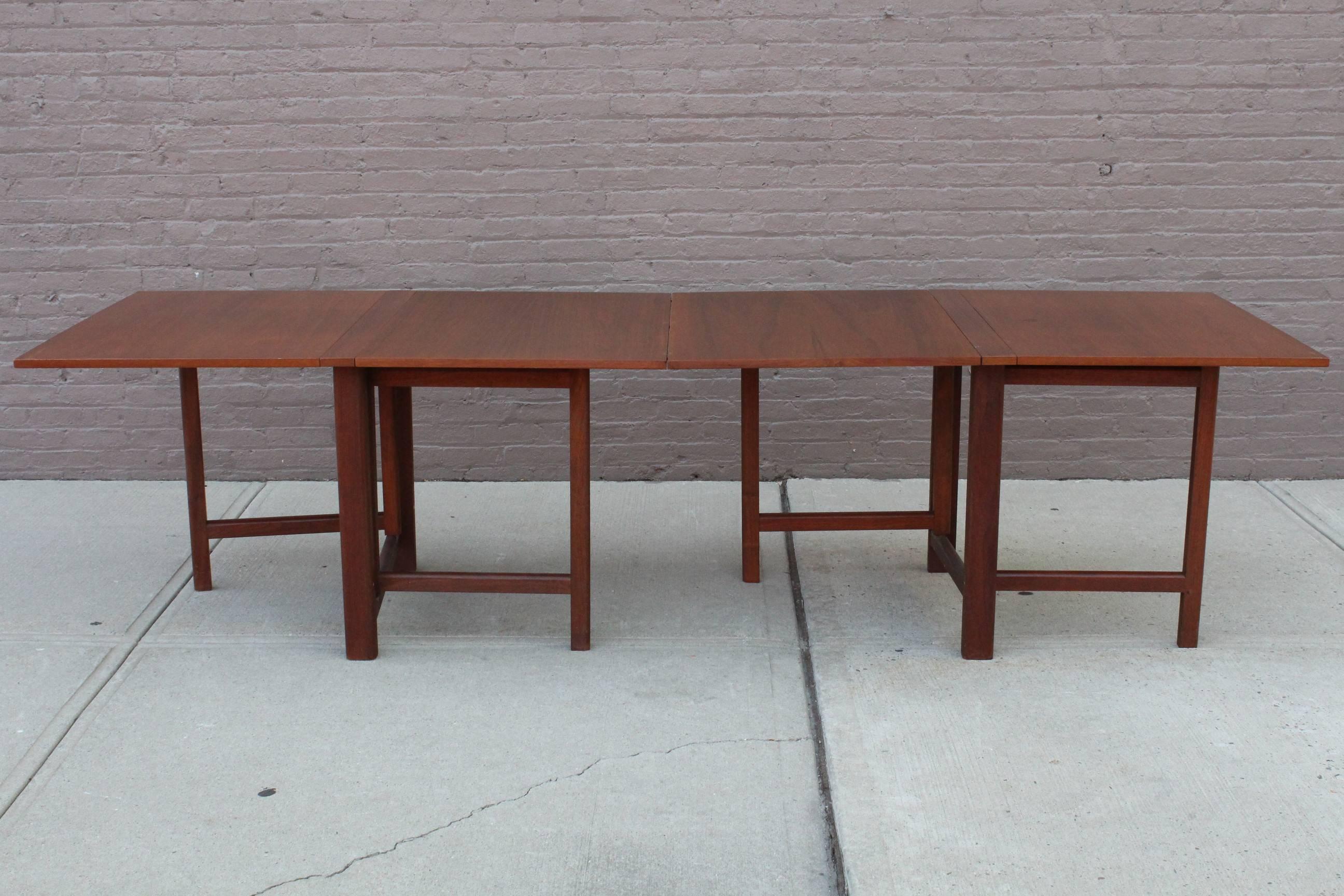 The 'Maria' teak wood dining table, originally designed by Bruno Mathsson, manufactured in Denmark, circa 1960s, the top comprised of drop leaves on a gateleg base, which enables this piece to be compacted or extended. The table remains in overall