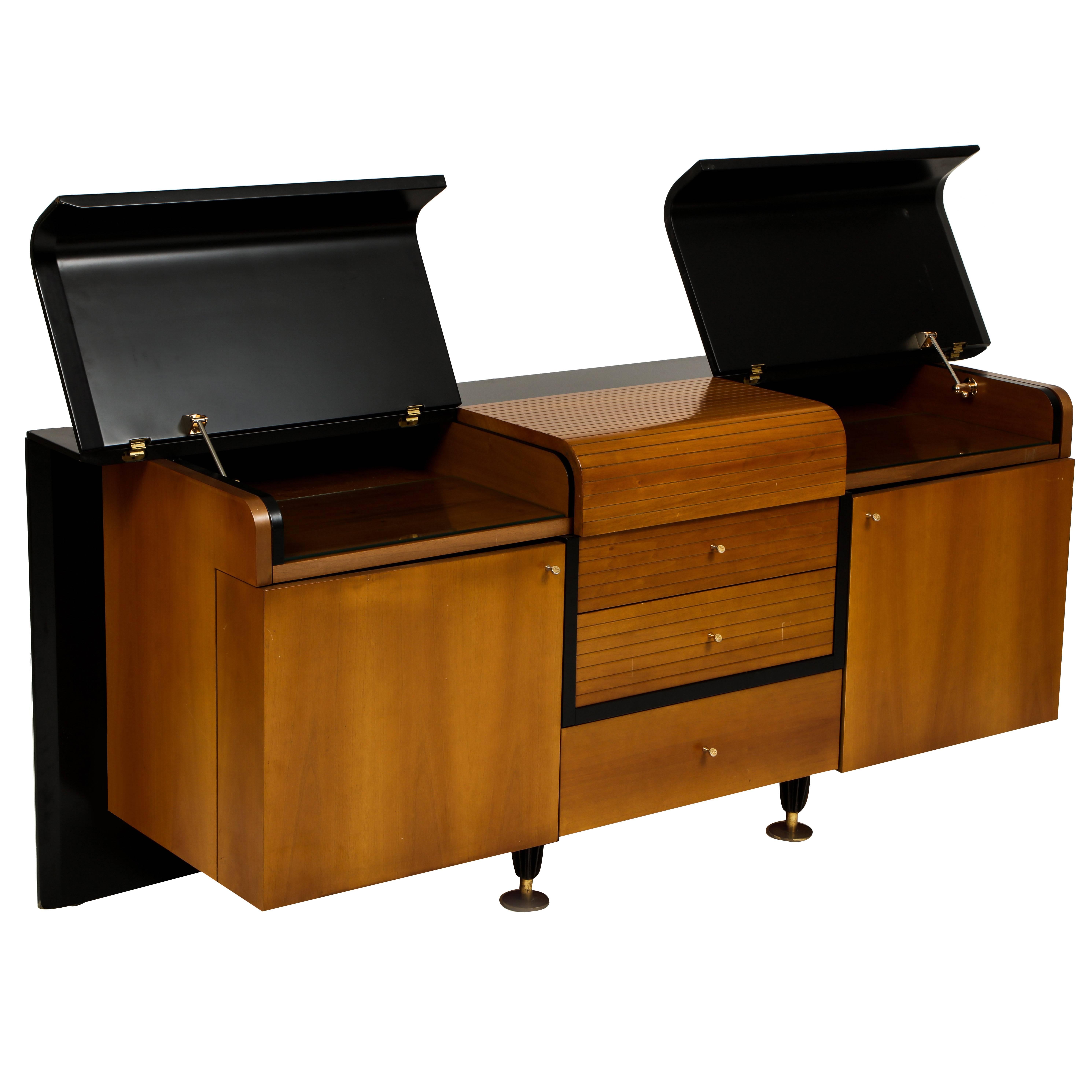 Pierre Cardin sideboard buffet black and wood, 1980s-1990s.

This rare sideboard is in excellent vintage condition with two top sides that come up and plenty of storage.
It is made of laminate and wood with brass details throughout.
There is a