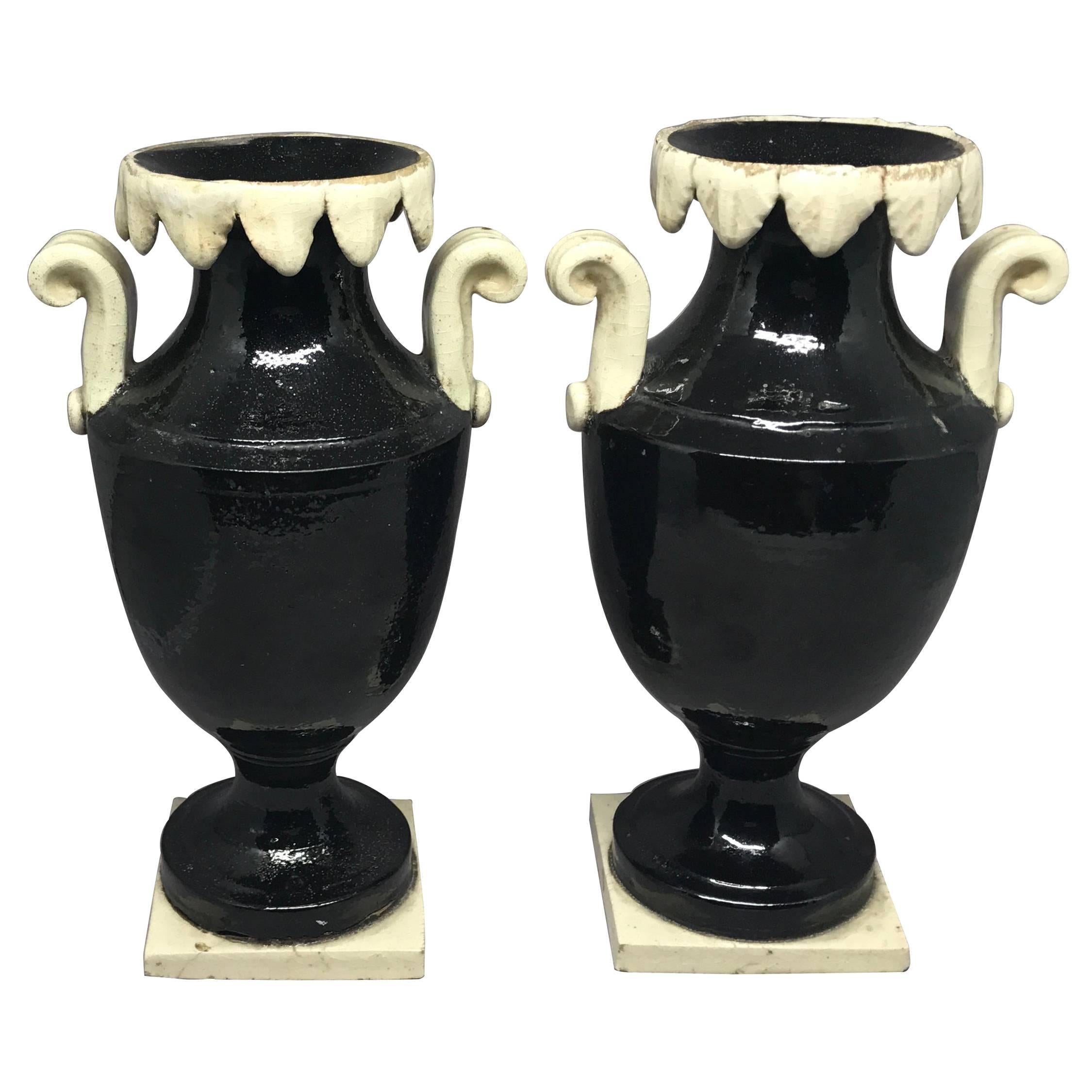 Pair of Neoclassical Black and White Giustiniani Urns For Sale