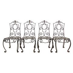 Set of Four Jean-Charles Moreux Style Wrought Iron Chairs