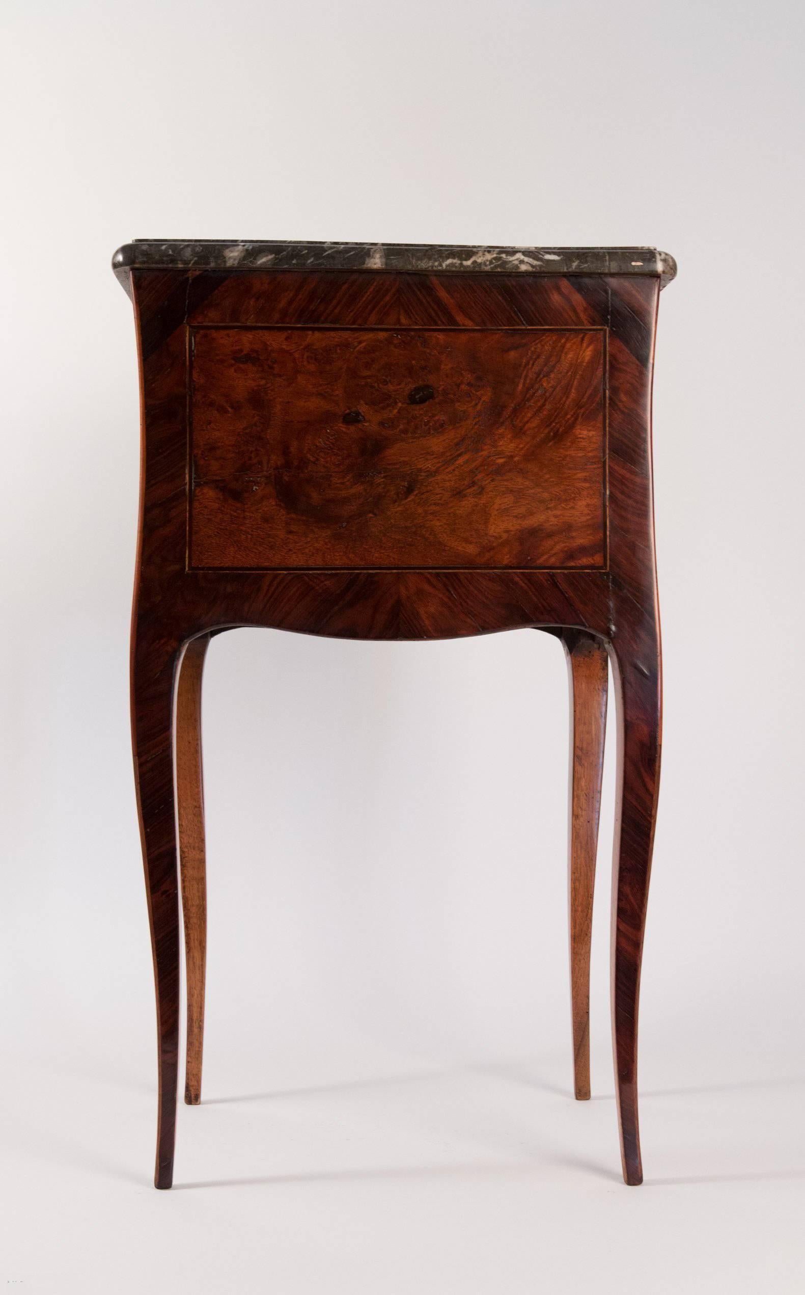 An lovely and fine quality small Louis XV style, Fruitwood, kingwood and Amboyna commode with two drawers and elegant cabriole legs, called a 