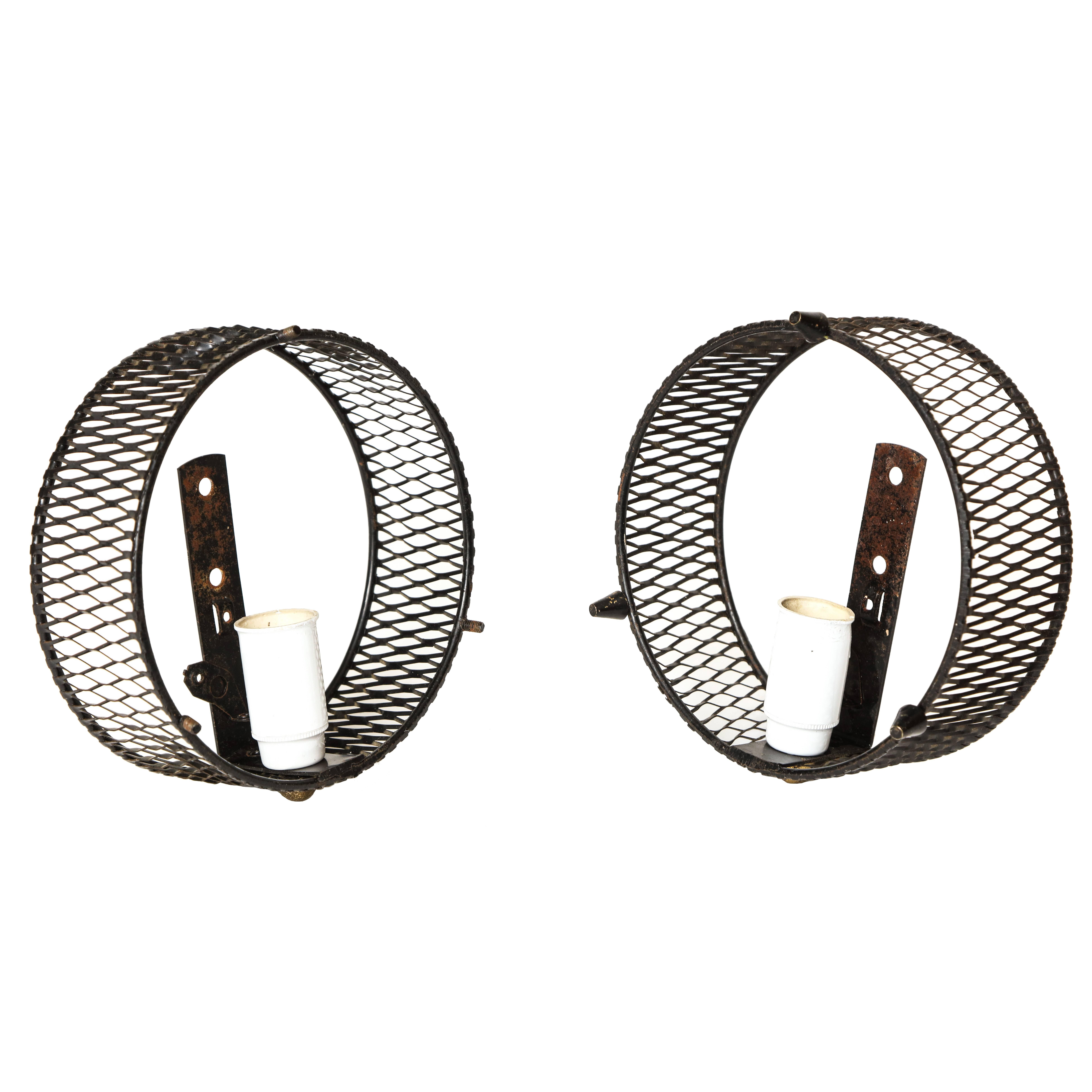 Perforated Jacques Biny sconces black, Mid-Century, France, 1950s.

Lovely black small-scale Biny sconces.

Measures: Diameter 14.5 cm x 5 cm.

Same era as: Charlotte Perriand, Jean Prouve, Pierre Pauline, Serge Mouille, Jacques Adnet, Jean Royere,