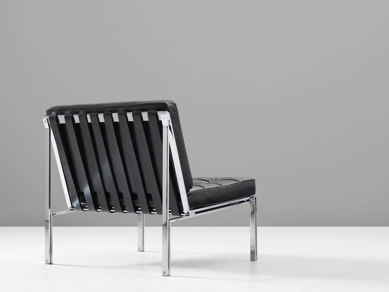 Lounge chair KT-221, in chromed metal and black leather, by Kurth Thutt for Desede, Switzerland, 1956.

Modern and sleek chair by Swiss designer Kurth Thut. This architectural piece consist of a chromed steel frame with leather straps as seating and