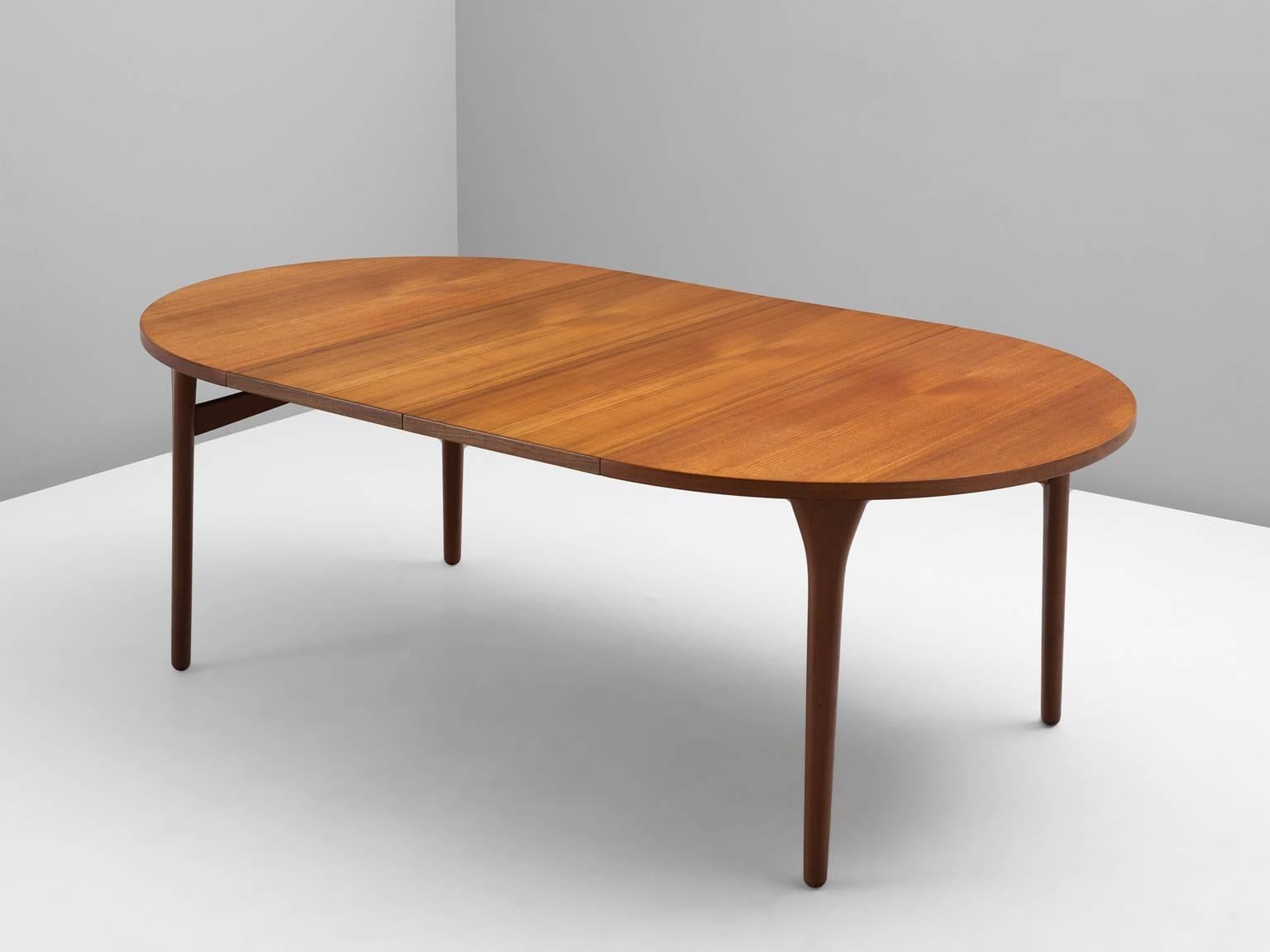 Dining table, in teak, by Henning Kjaernulf for Bruno Hansen, Denmark, 1950s.

Extendable dining table in teak. Large oval shaped table with two additional leafs. Beautiful grain is visible on the large oval top. Without the leaves this is an