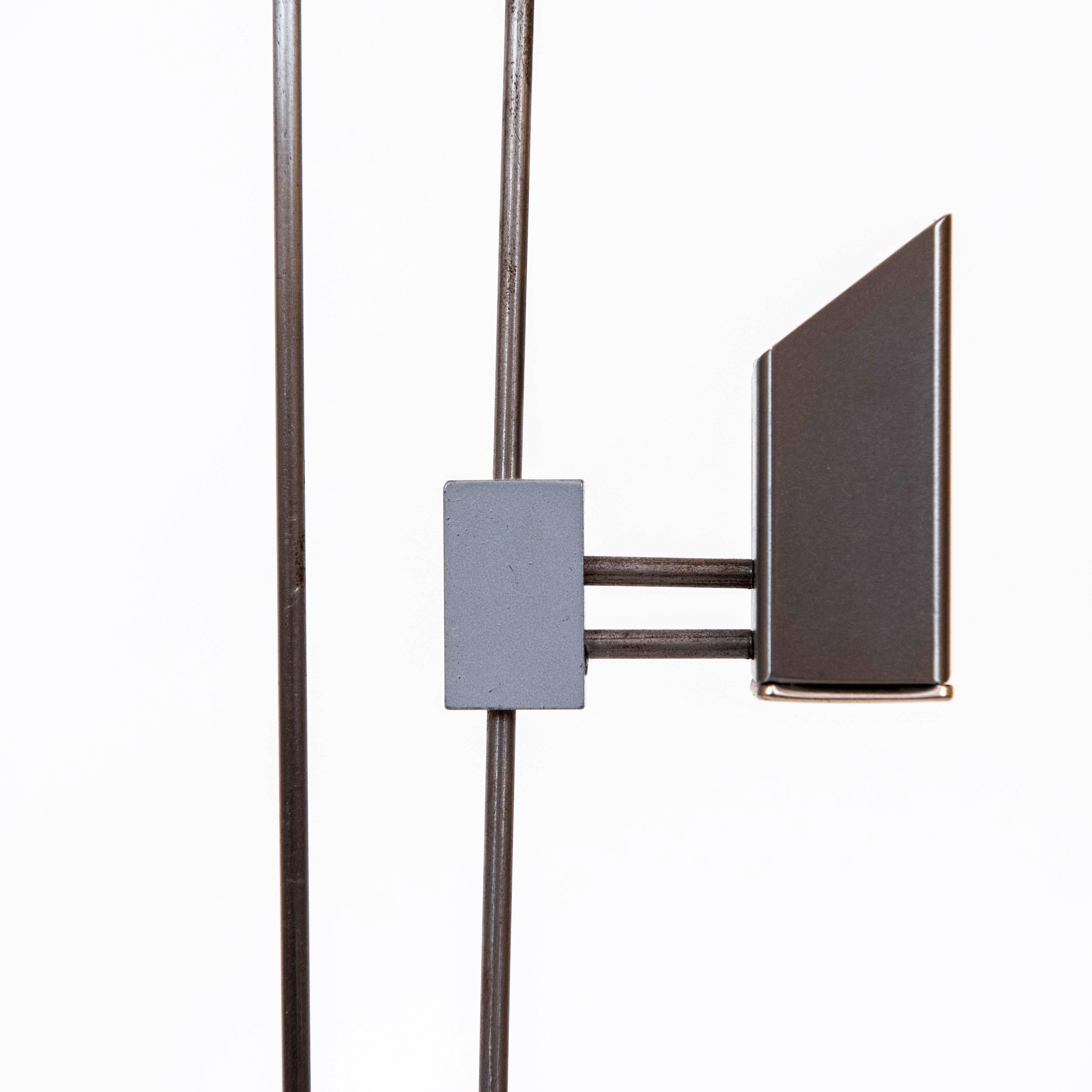 These adjustable and cool sculptural metal candle holders are by David Zelman and are signed and dated D. Zelman, Prologue, 1988. The holders are able to pivot and move up and down the rod. Great form!

  