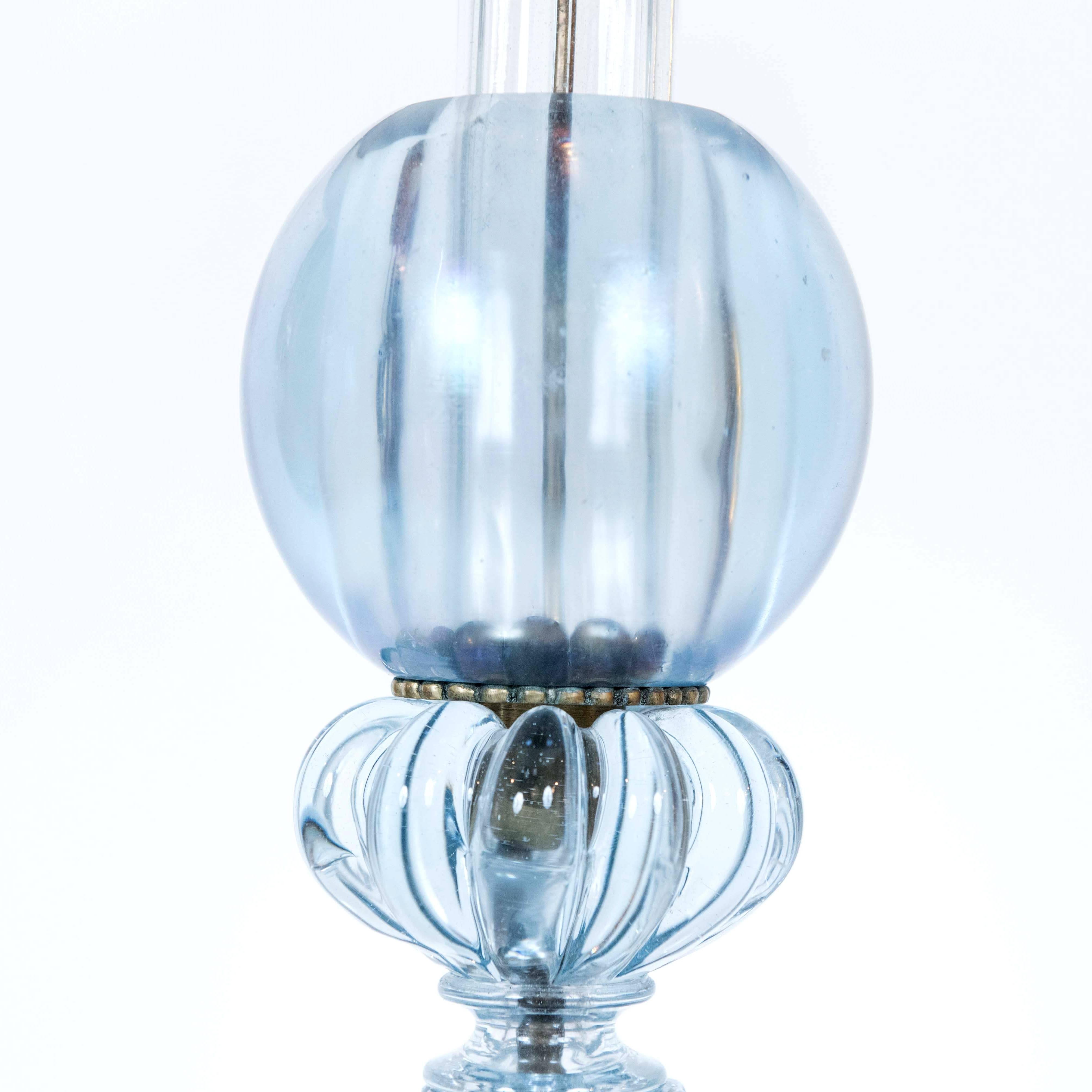 These translucent and unique blue Murano lamps are stunning with their matching glass base and large glass ball decoration. The overall height with shade is 28.5