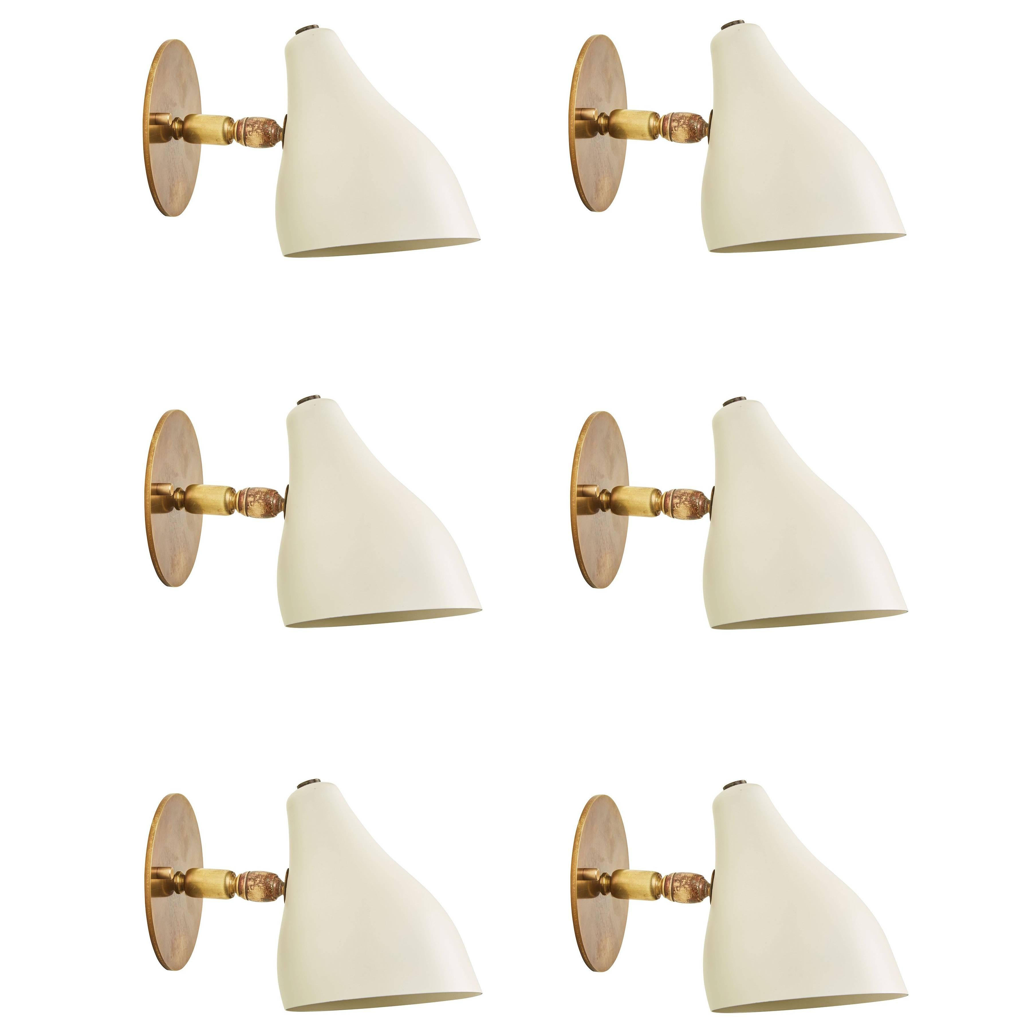 Seven Articulating Brass and Metal Sconces by Stilux