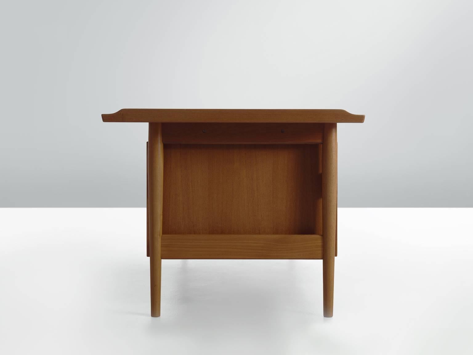 Executive desk, in teak by Arne Vodder for Sibast, Denmark, 1960s. 

This luxurious piece was designed by one of the best designers Denmark has known and is produced by Sibast. Vodder designed a large series of desks for this company, including