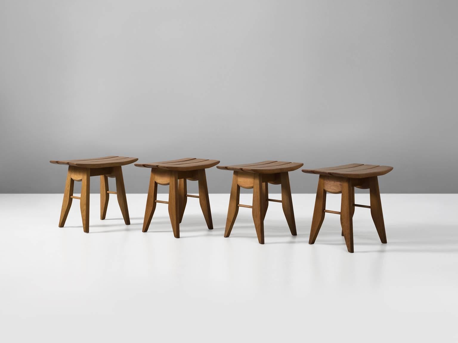 Set of four stools, in oak, by Guillerme et Chambron, France, 1960s.

Set of four tabourets in oak, by French designer duo Guillerme and Chambron. These stools have an interesting appearance. The top is made of three slats, the two on the outside
