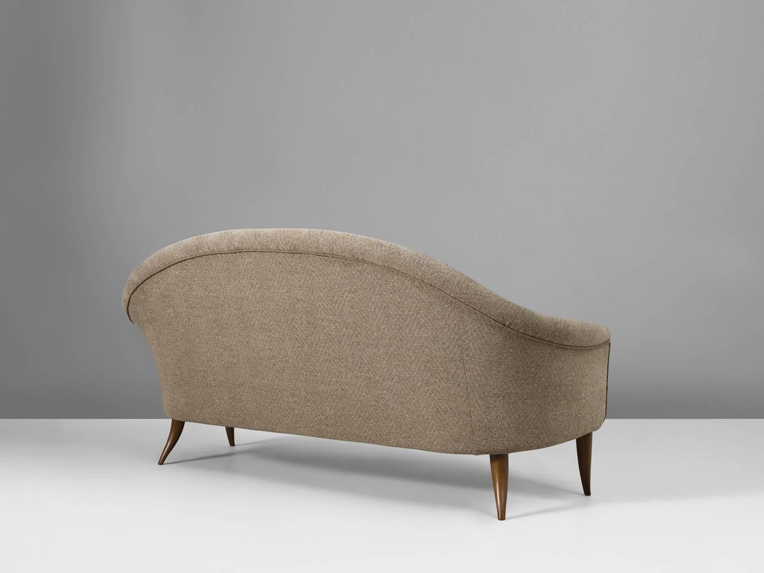 Sofa 'Stora Paradiset', in fabric and wood, by Kerstin Horlin-Holmqvist for Nordiska Kompaniet, Sweden, 1958. 

The beautifully tapered and curved legs compliment the design of the seat perfectly. The armrests run over smoothly into the back and