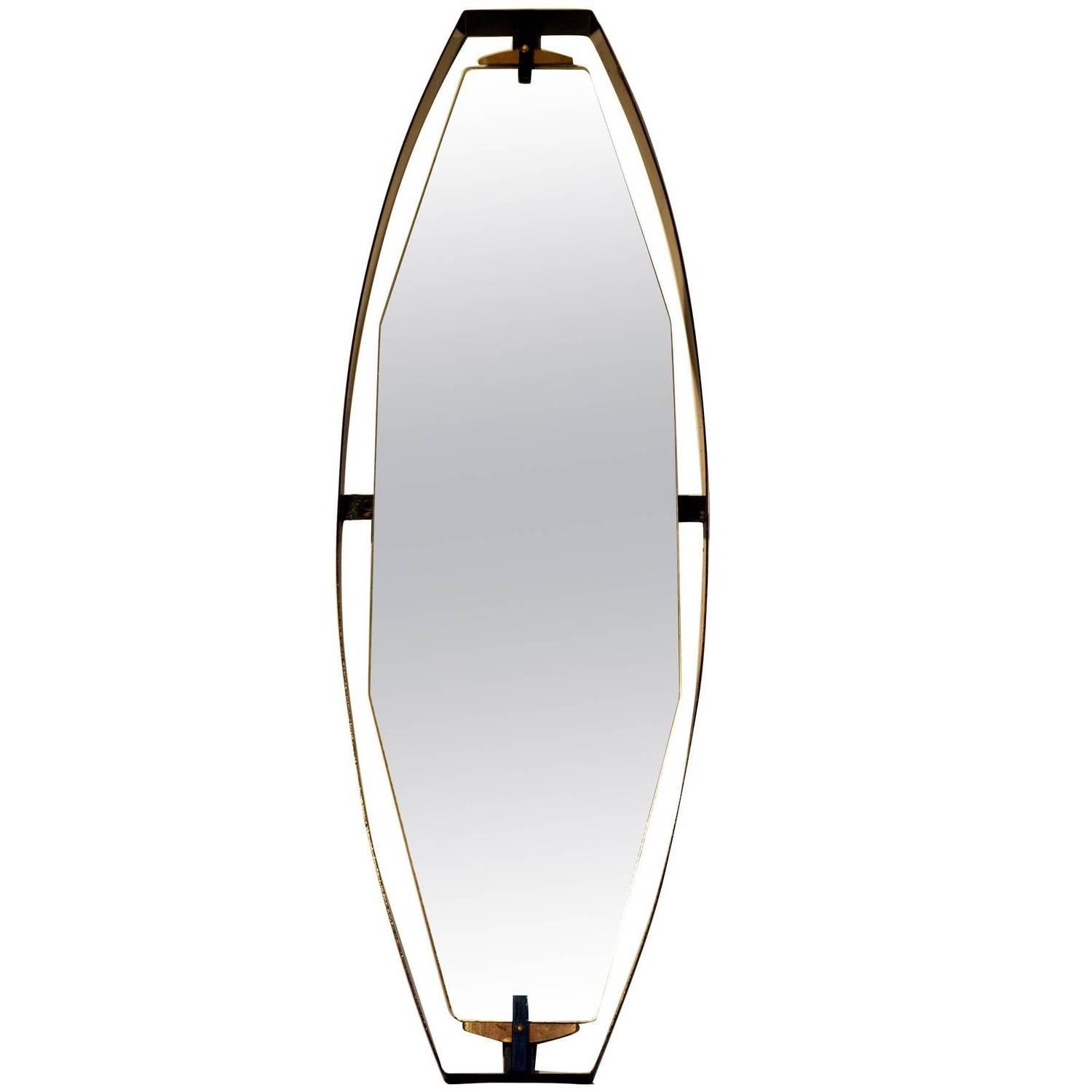 Diamond shaped full size mirrors float in a curvaceous black metal frame. The sculptural form is held together by brass and metal fittings details from above and below. The glass is original and marked.
The black border is re-powder coated and in