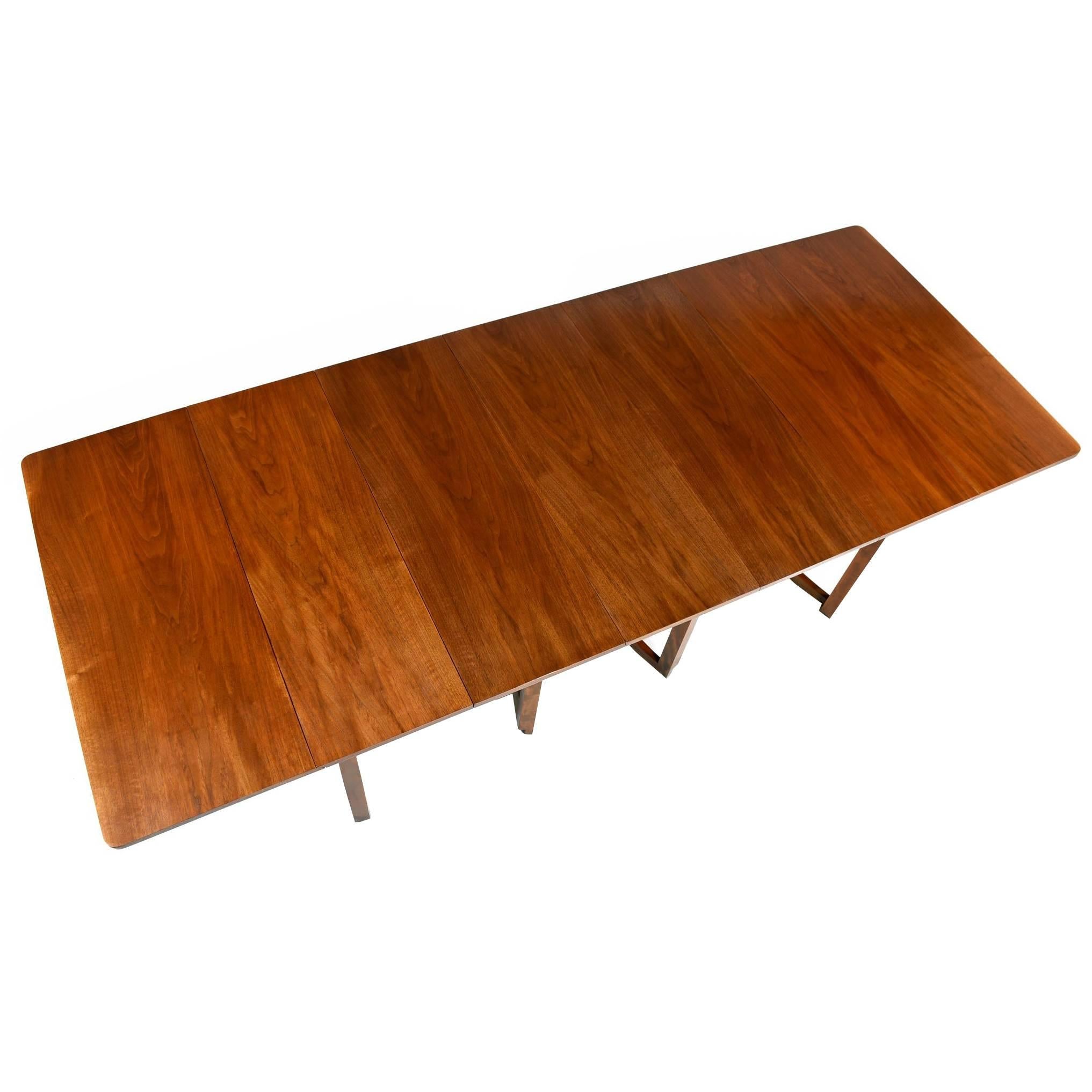 Exquisite Mid-Century Modern table designed by T.H. Robsjohn-Gibbings for Widdicomb. The table bears the original maker's label and designer's name on the underside. Our team of in-house professionals have restored this table back to its original