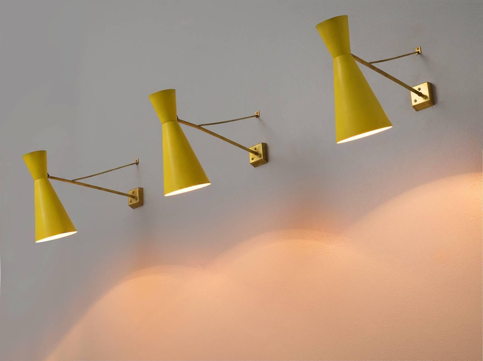 Set of five yellow wall lights, brass, Italy, 1960s. 

These lights have a very airy and playful appearance because of their thin brass rods. The soft and lemon-like yellow is a wonderful combination with the brass. They have an Industrial and