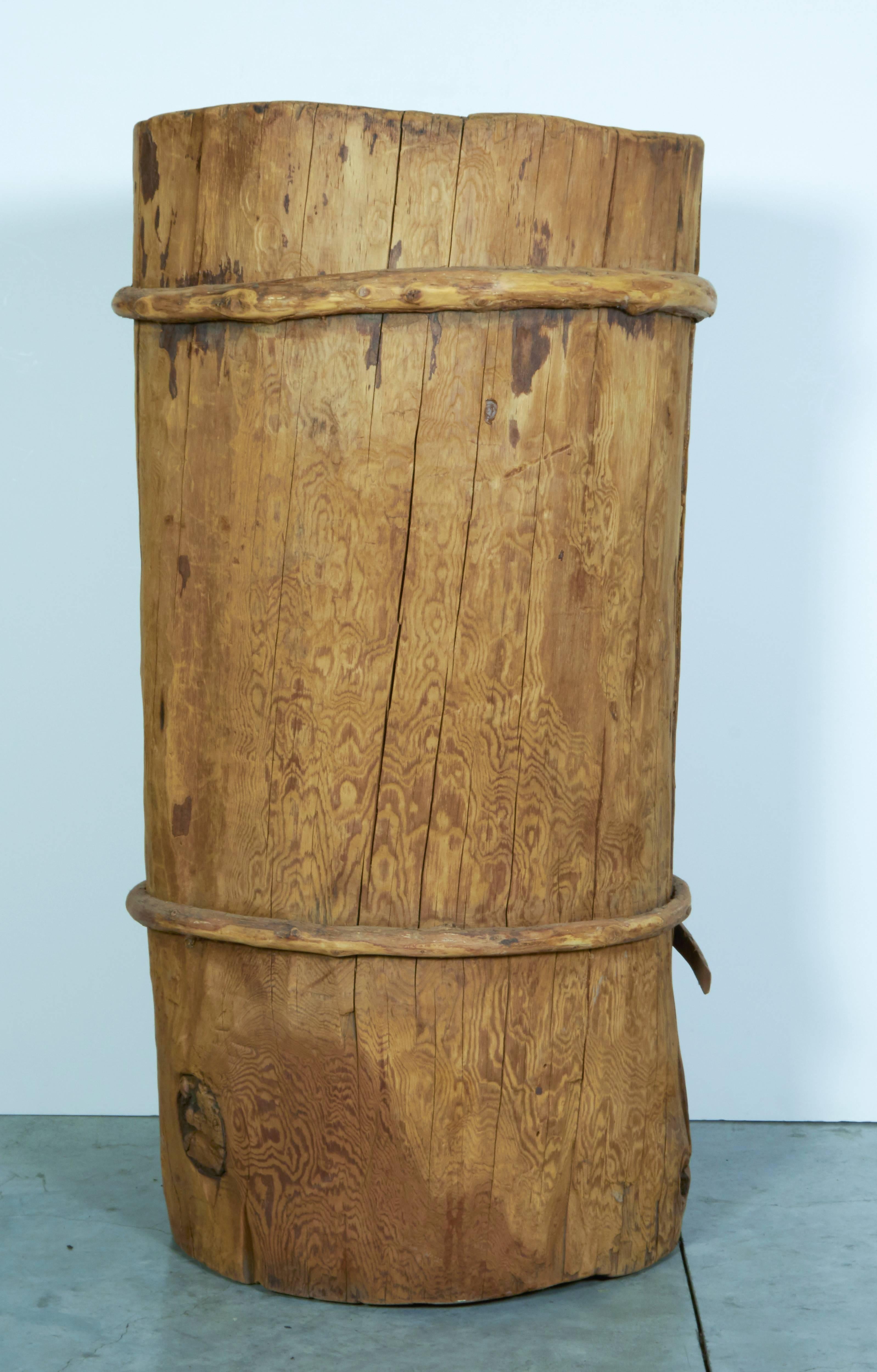 An unusually large yak milk churn from Yunan Province, China, circa 1930. This piece has a beautiful patina from years of use and two beautifully knotted wooden straps.
BT374a.