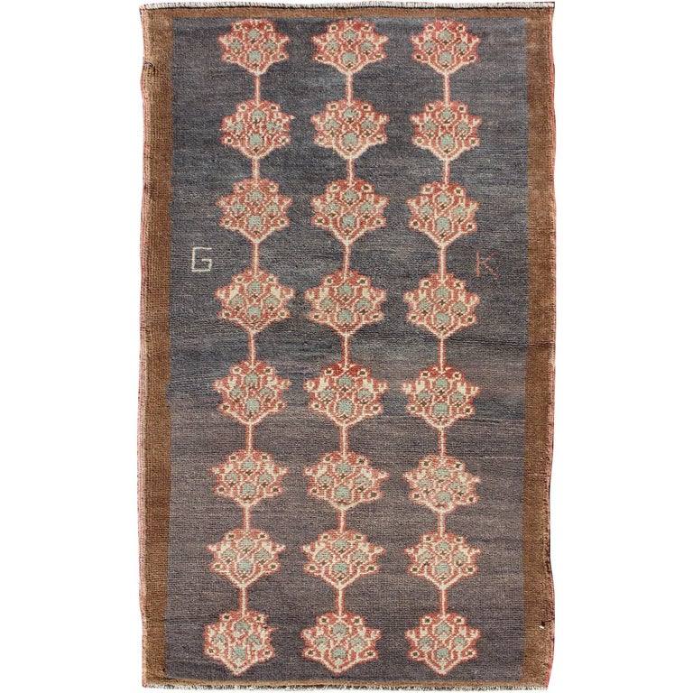 Turkish Tulu Carpet with Several Paisley Medallions on a Navy Blue Field For Sale at 1stdibs