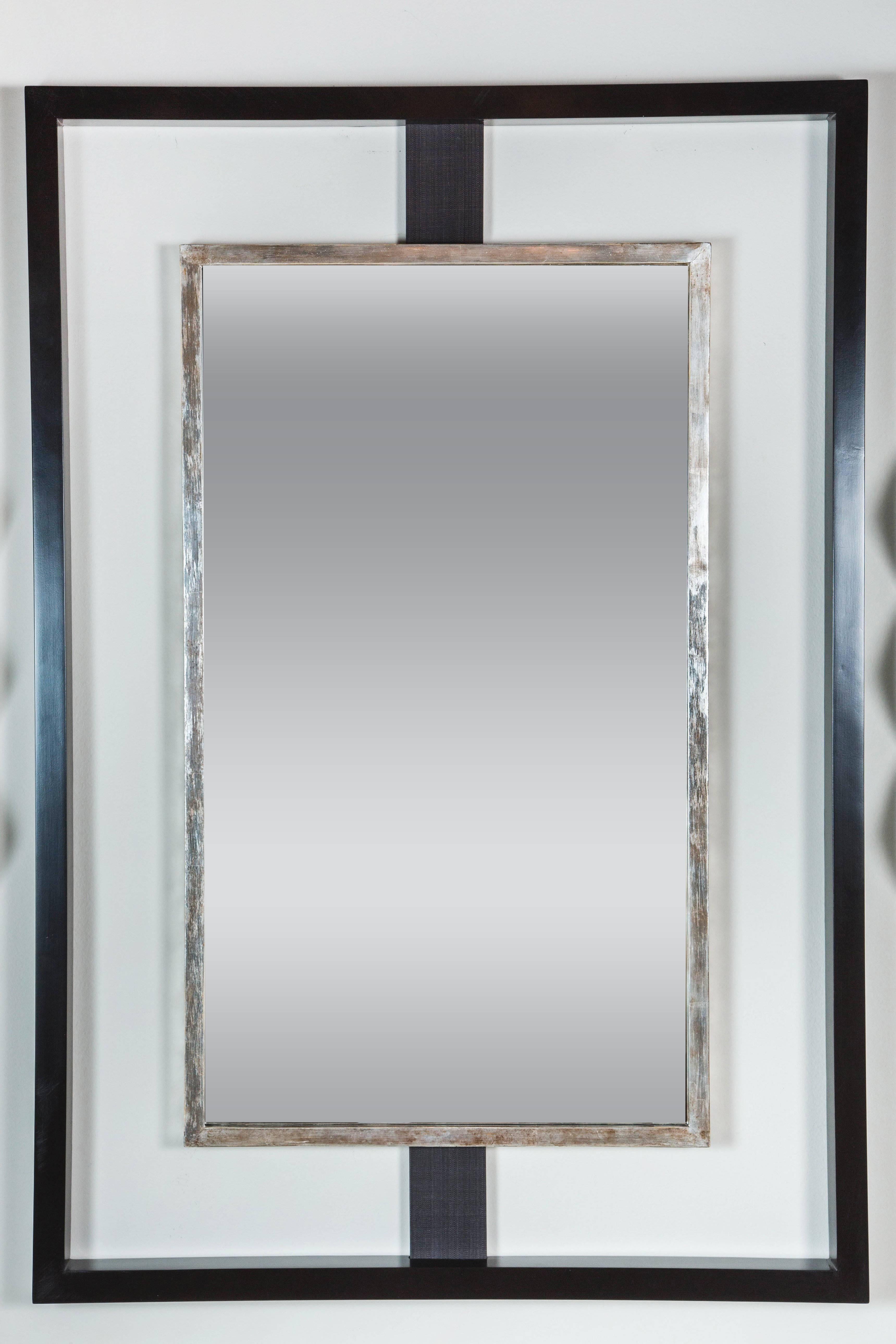 Modern Paul Marra Negative Space Mirror shown in ebony stained outer frame and distressed silver inner frame, dark gray-black horsehair strut. By order,  production lead approximately 6 weeks. Due to materials and the hand-made process the wood and