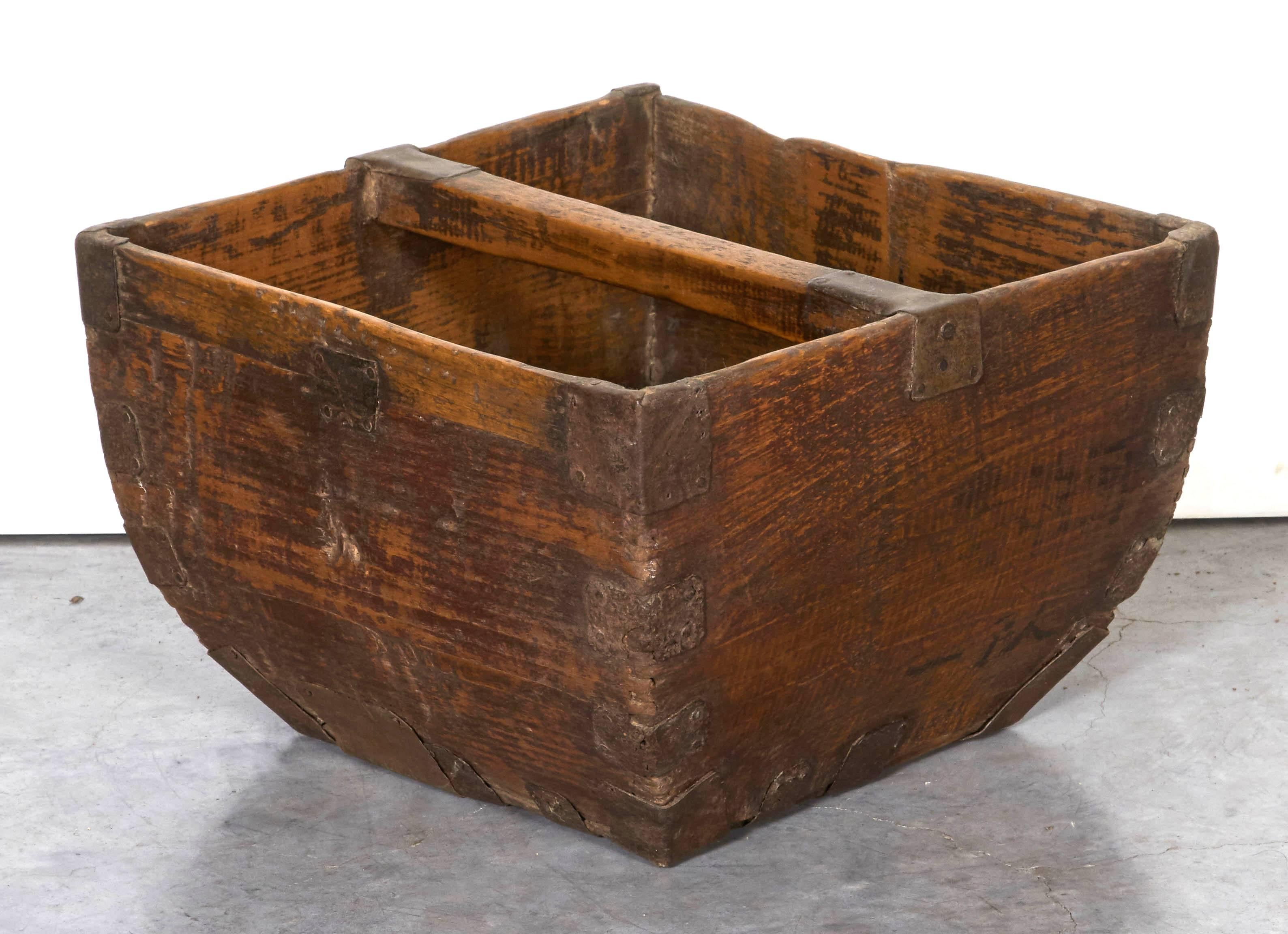 A rustic antique Chinese rice measure basket with beautiful patina and original metal hardware. Not just a beautiful object, but a very functional box for mail, magazines, or in the entry way for flip flops or dog leashes and toys. From Shandong