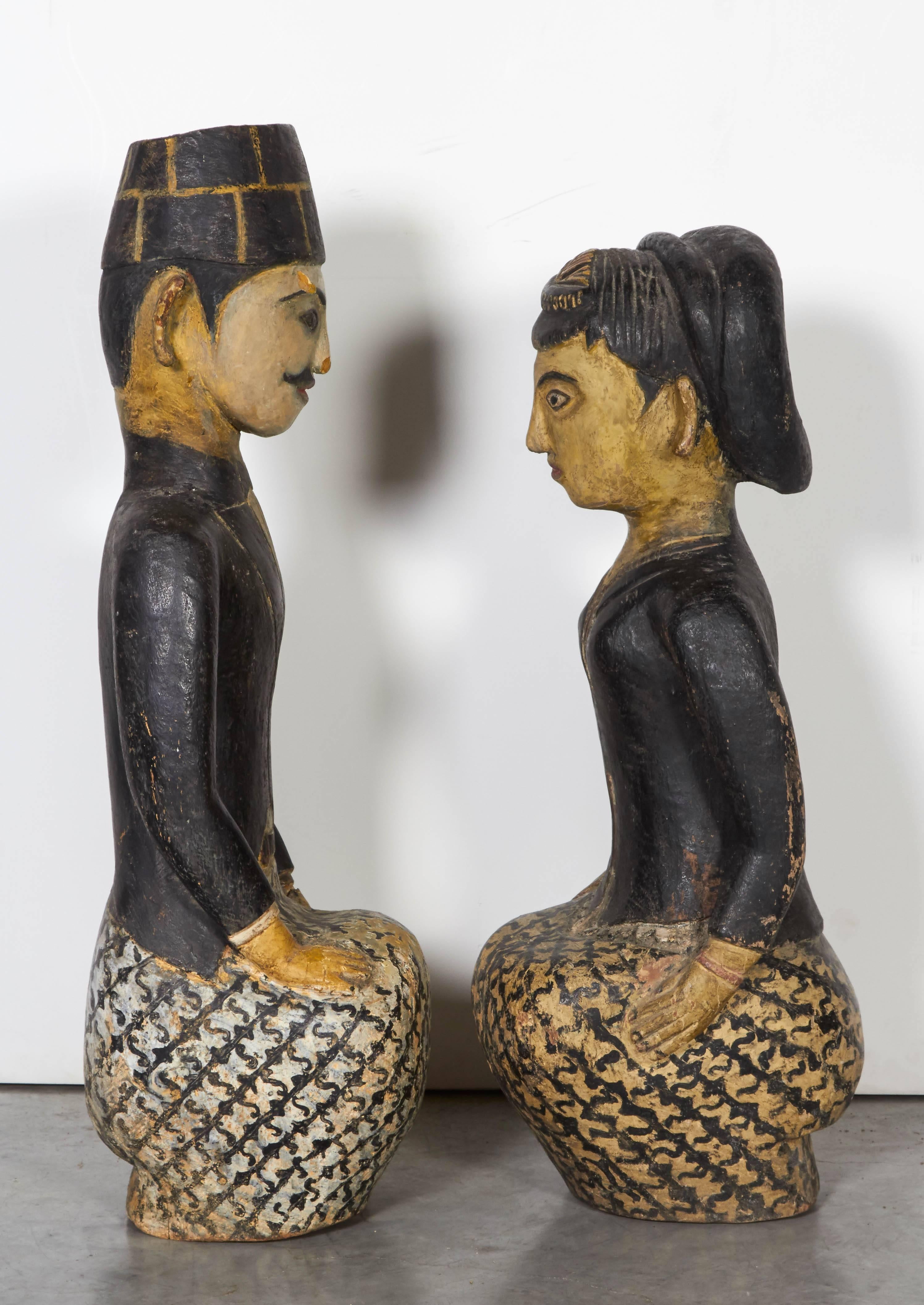 Expertly carved and sensitively painted antique Loro Blonyo figures from Java, Indonesia. These pieces represent the 