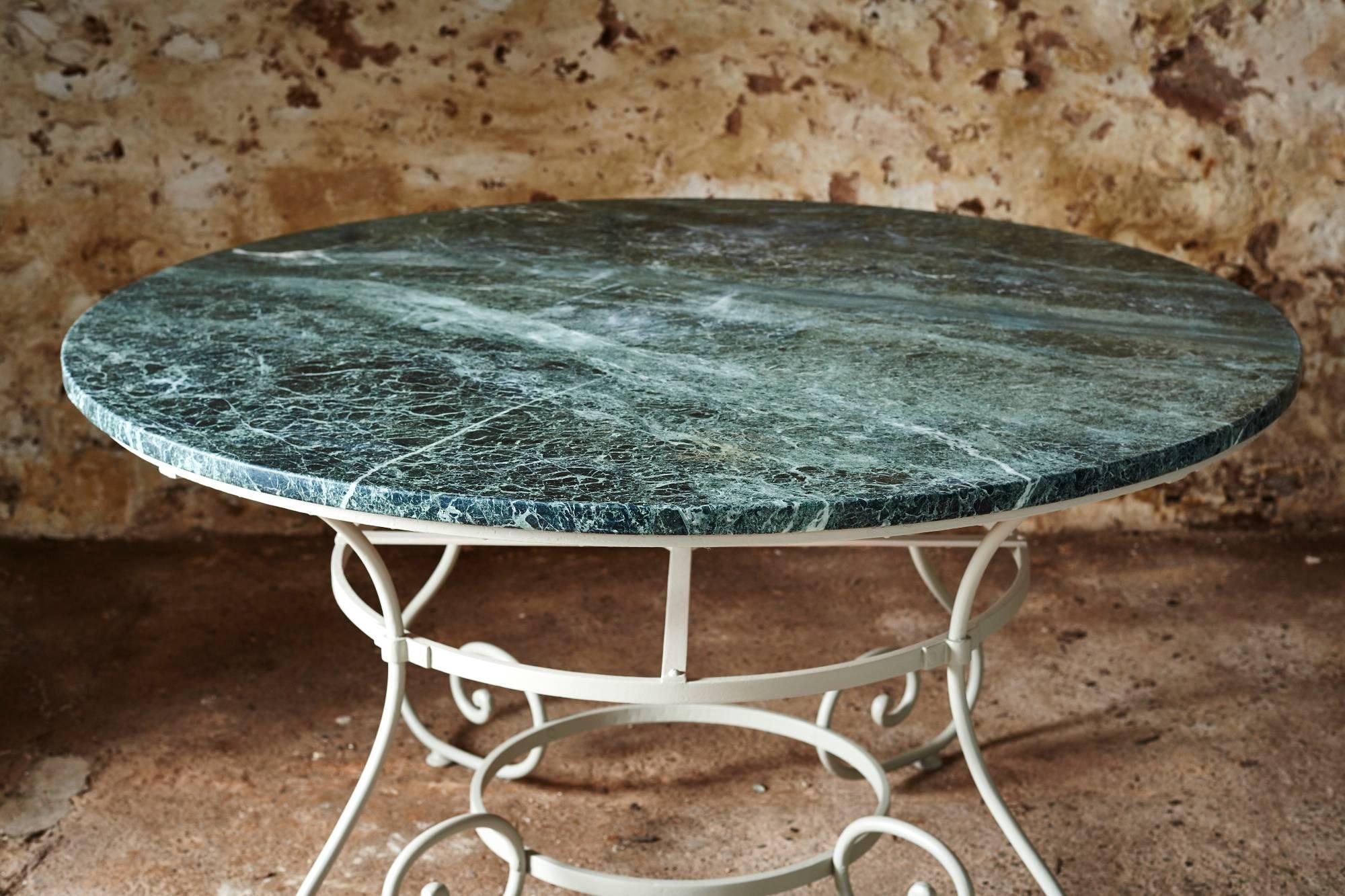 
A round, late 19th century Parisian table with a remarkable green marble top
This lovely table would have been hand-forged on a riveted wrought iron frame.
It would make a stunning display, garden or dining room table.
  
  