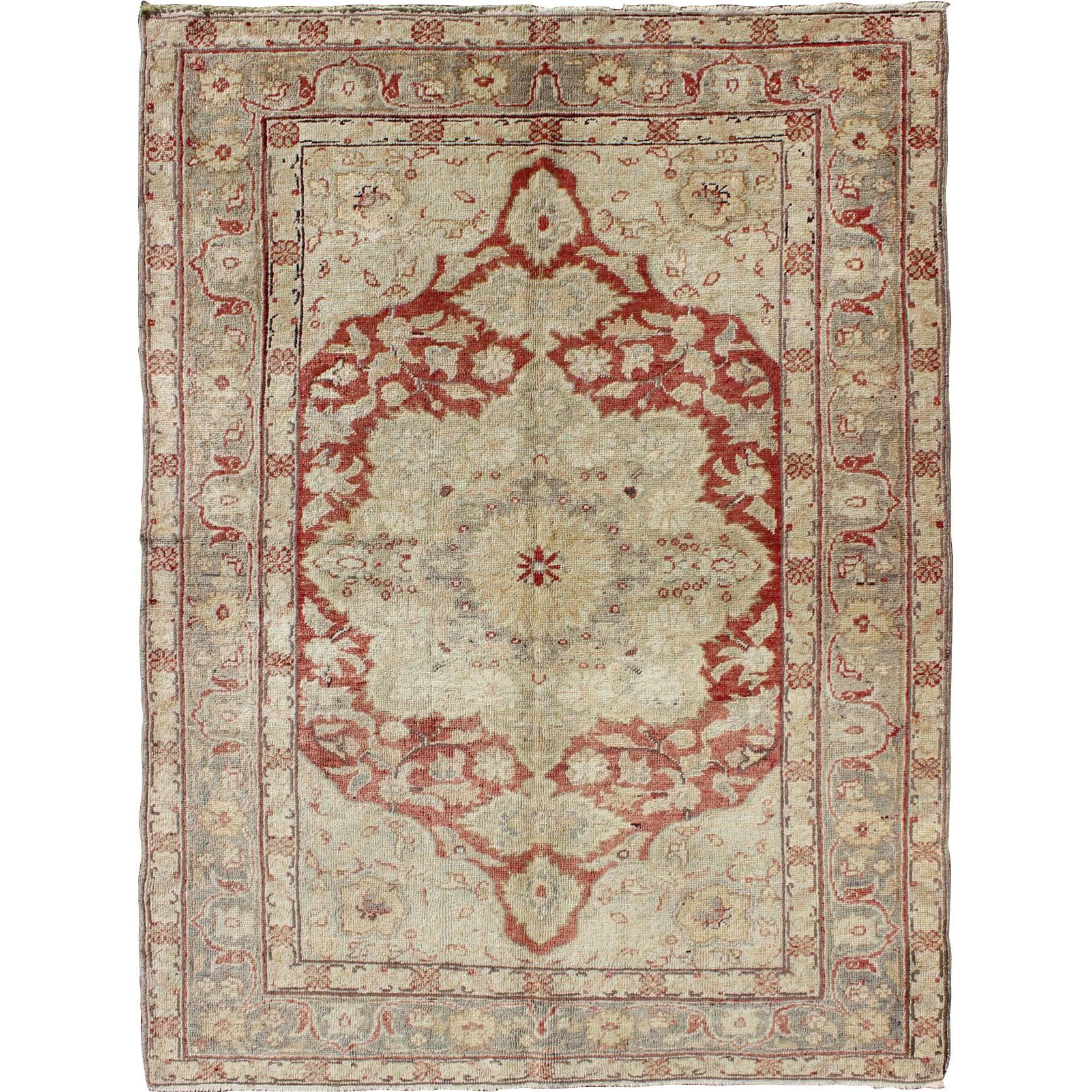 Fine Turkish Oushak Carpet with Center Medallion in Light Red and Cream For Sale
