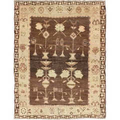 Vintage Turkish Oushak Carpet with Tribal Design Set on Brown Background