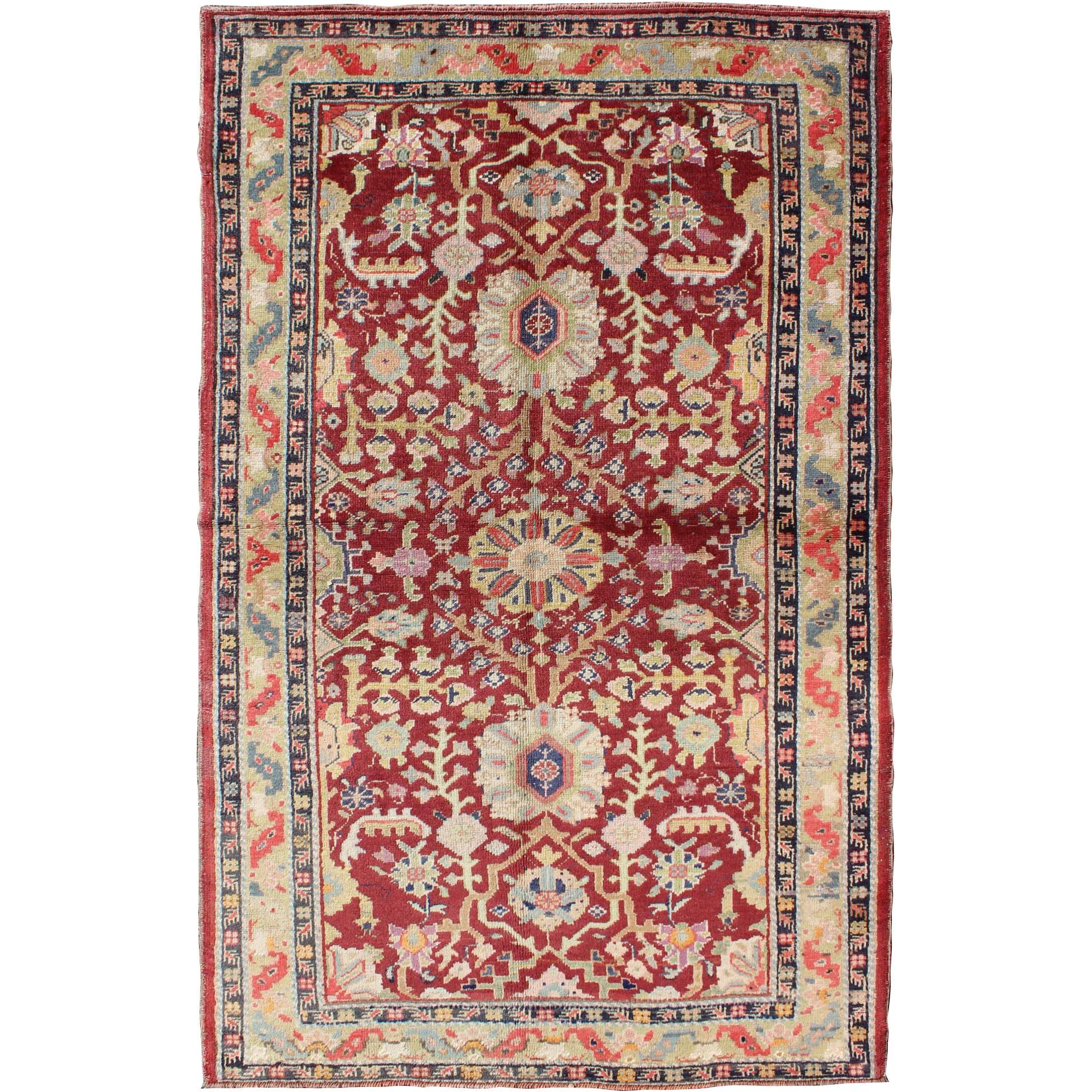 Colorful Turkish Oushak Carpet with Scattered Vines and Flowers on a Red Field