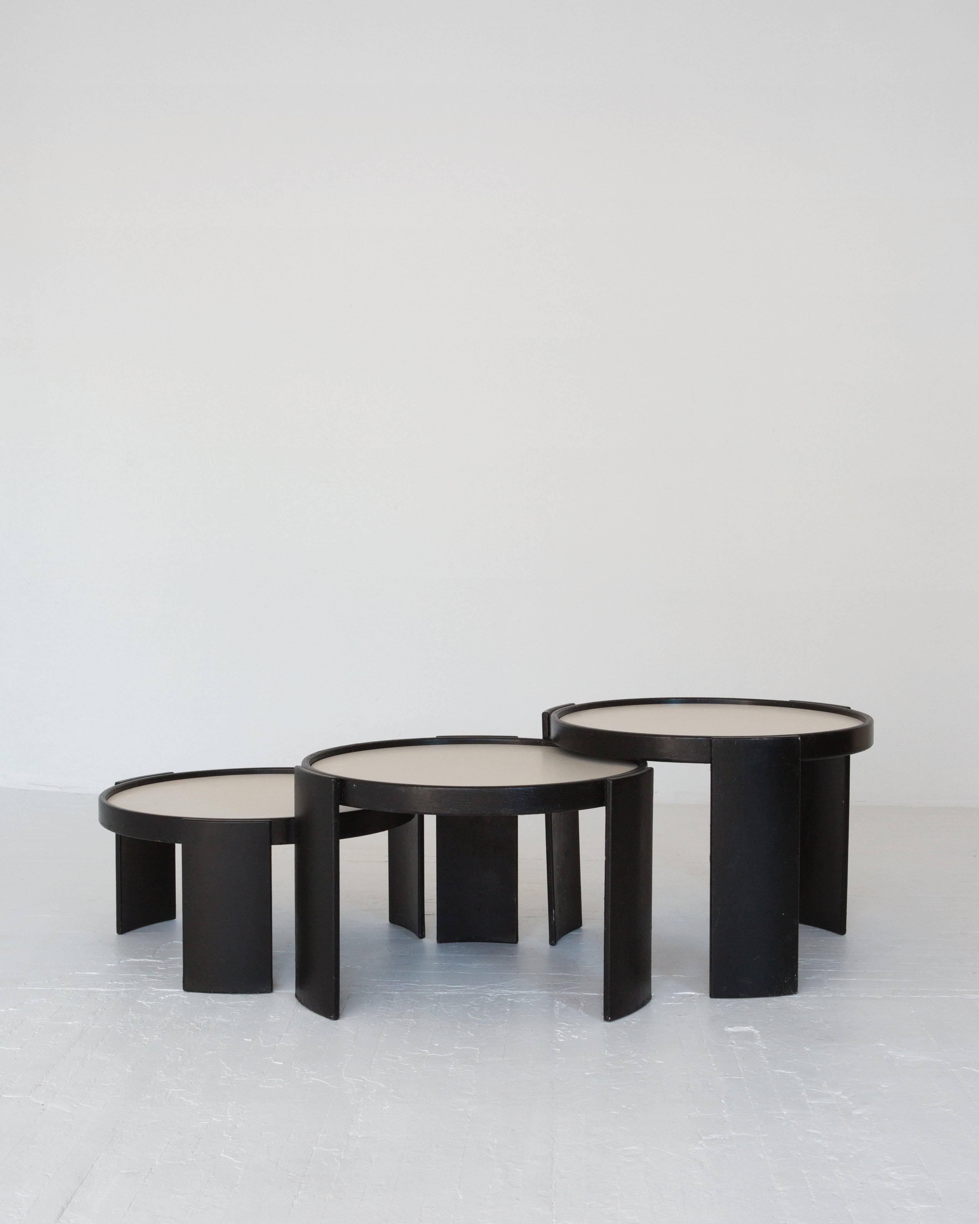 A set of black and white lacquered wood Gianfranco Frattini nesting tables. 

Measures: Smaller sizes: 15.25