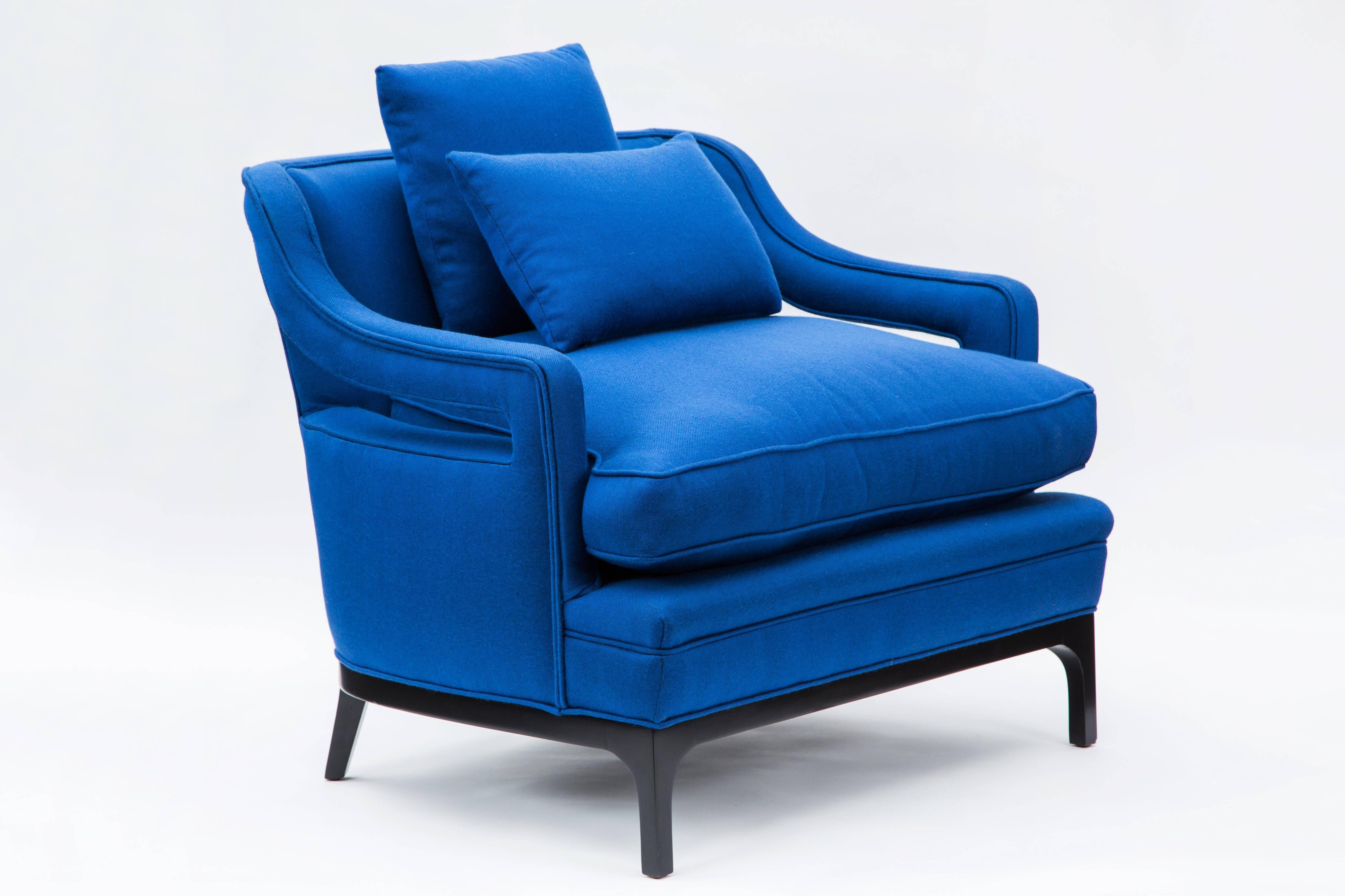 Glamorous pair of club chairs in the style of James Mont, circa 1960s. Chairs are generous in size and are highlighted by the graceful and sculptural arm detail. Newly re-upholstered in a cobalt wool fabric blend.