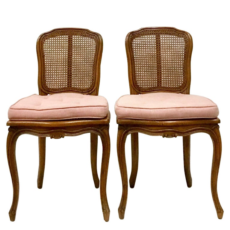 MidCentury Pair Of French Style Carved Wood and Cane Chairs For Sale