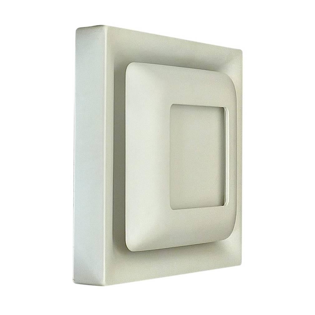 Amazing Midcentury Modern set of five signed square wall sconces / wall lights by Doria Leuchten, Germany around 1970 in white enameled metal for an indirect light wall illumination which can be arranged in multiple ways. This model which was