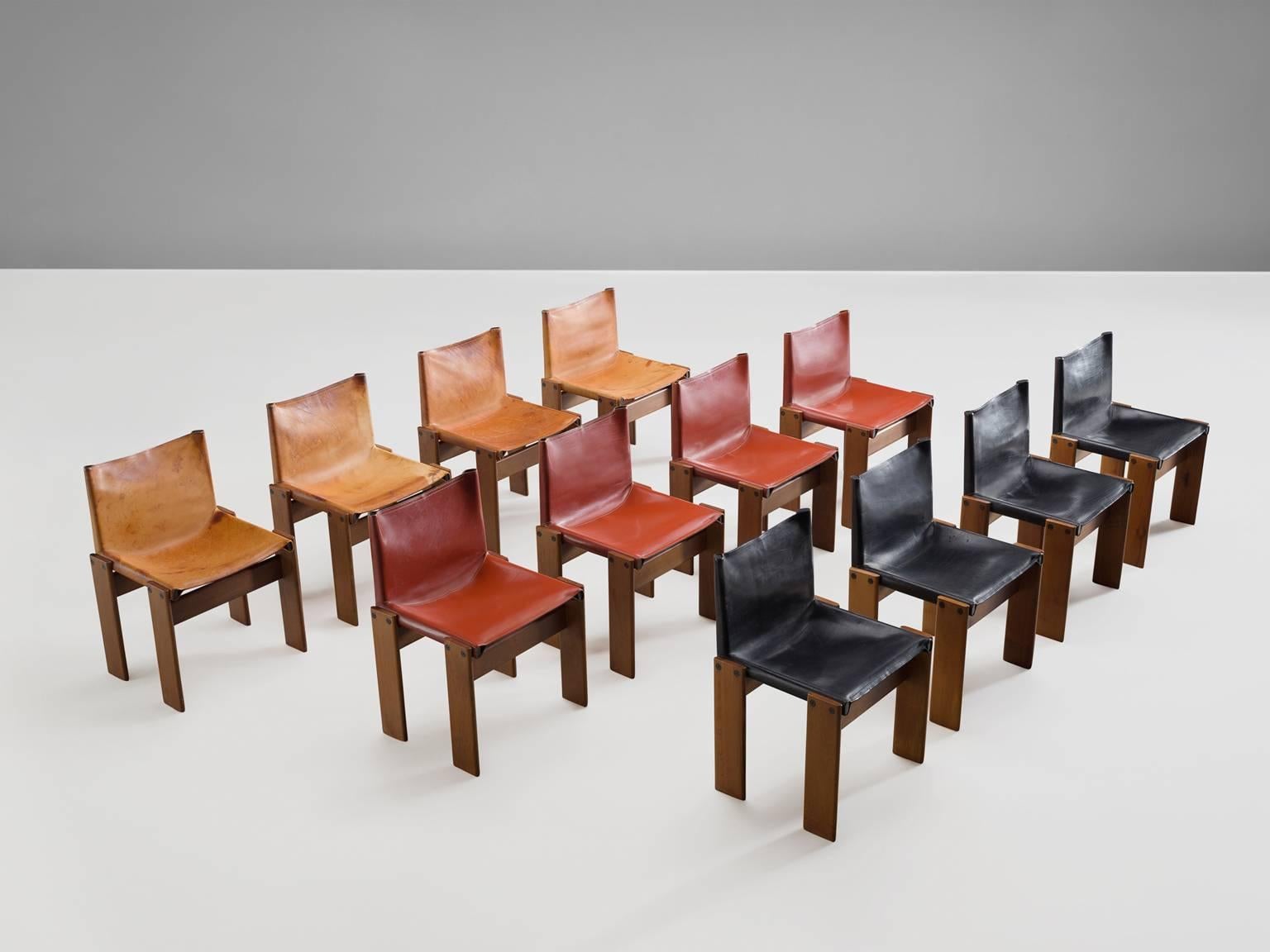 Dining chairs by Arfa & Tobia Scarpa, oak and cognac leather, Italy, 1974.

These 12 chairs are strong and sturdy in their design. The wonderfully warm leather in three colors is very well suited to the patinated walnut. Interesting is the 'flat'