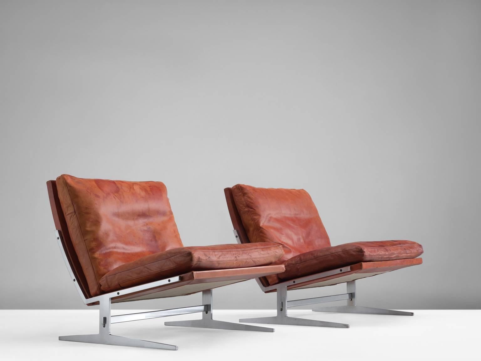 Set of chairs by Preben Fabricius and Jørgen Kastholm, steel and leather, Denmark, 1962.

Set of two modern slipper chairs in steel and leather. These chairs hold an L-shaped seating. This shape is repeated in the legs. A double L is mirrored to