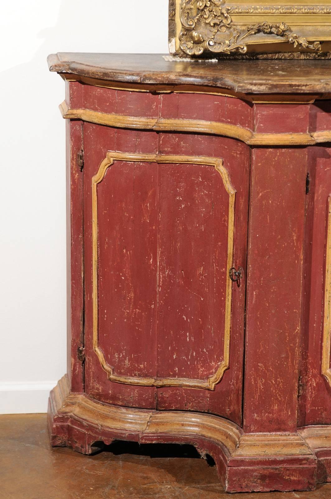 Italian Venetian Red Painted Serpentine Front Credenza with Two Drawers over Four Doors For Sale