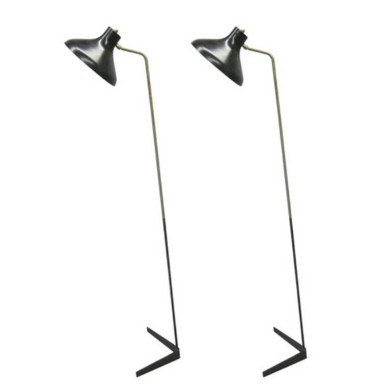 2 Sleek, Elegant Italian Mid-Century Modern Standing Lamps by Giuseppe Ostuni for O Luce. 

The base and stem set on an angular pattern and the reflector / shade is capable to rotate up, down and around in any direction to create a dramatic,