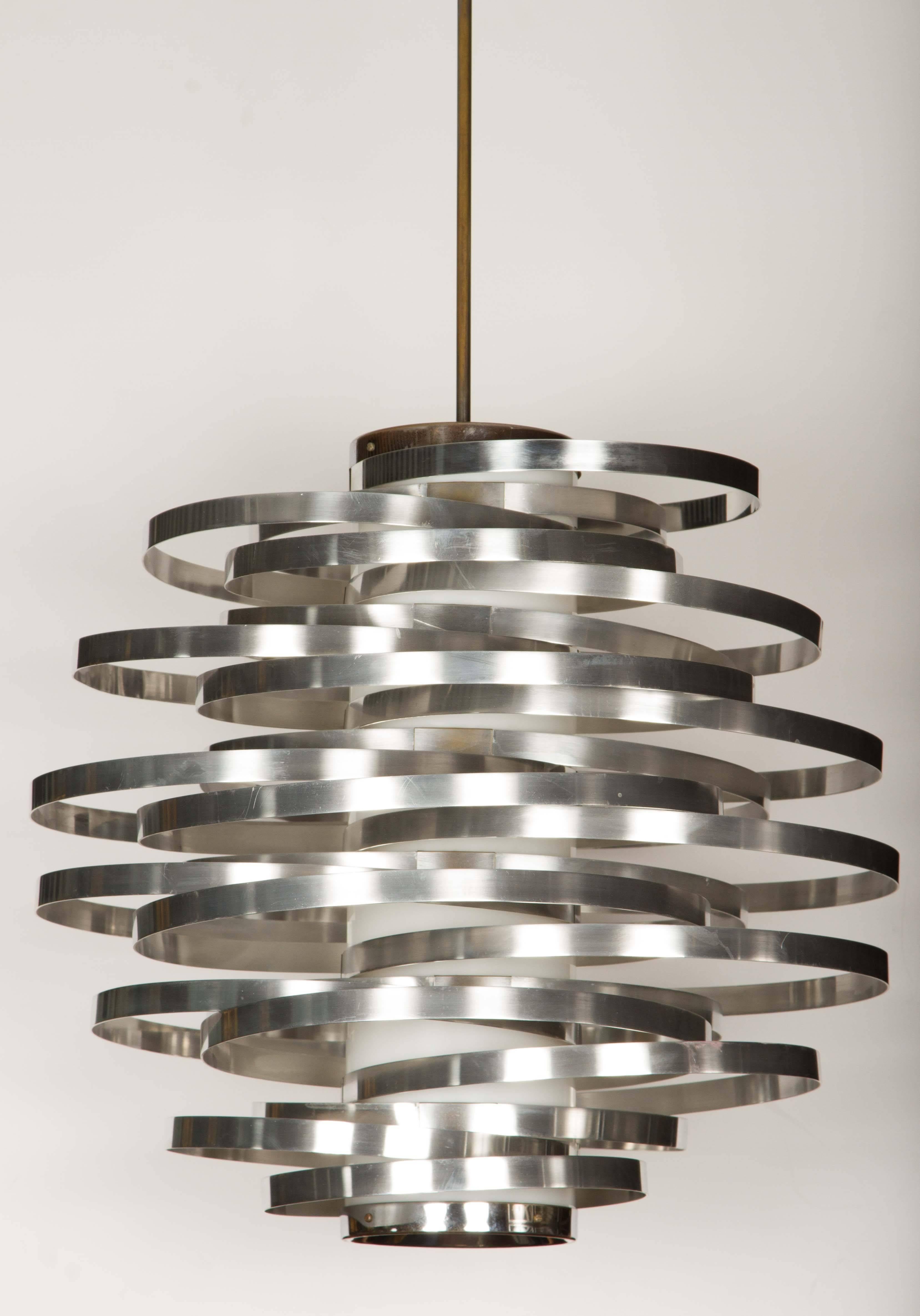 Modernist pendant composed of polished aluminum bands attached to an acrylic central column. Fixture has a double, medium socket light source and has recently been completely restored. Current total drop is: 36”. This is a period example.