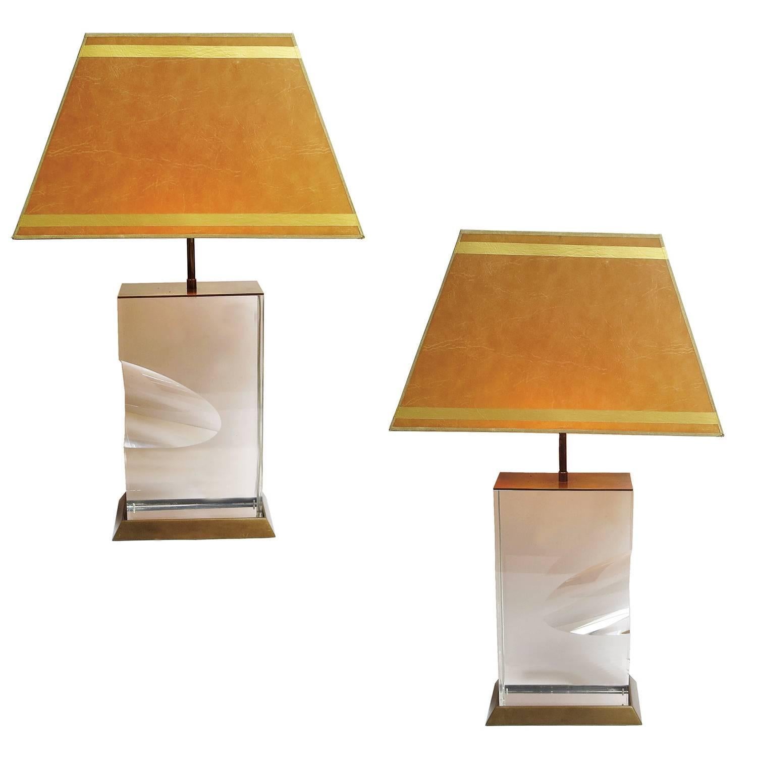This amazing pair are by the acrylic master Jeffrey Bigelow, signed and dated 1991. Both lamps are solid blocks of polished acrylic Lucite. There is a striking design element of a 