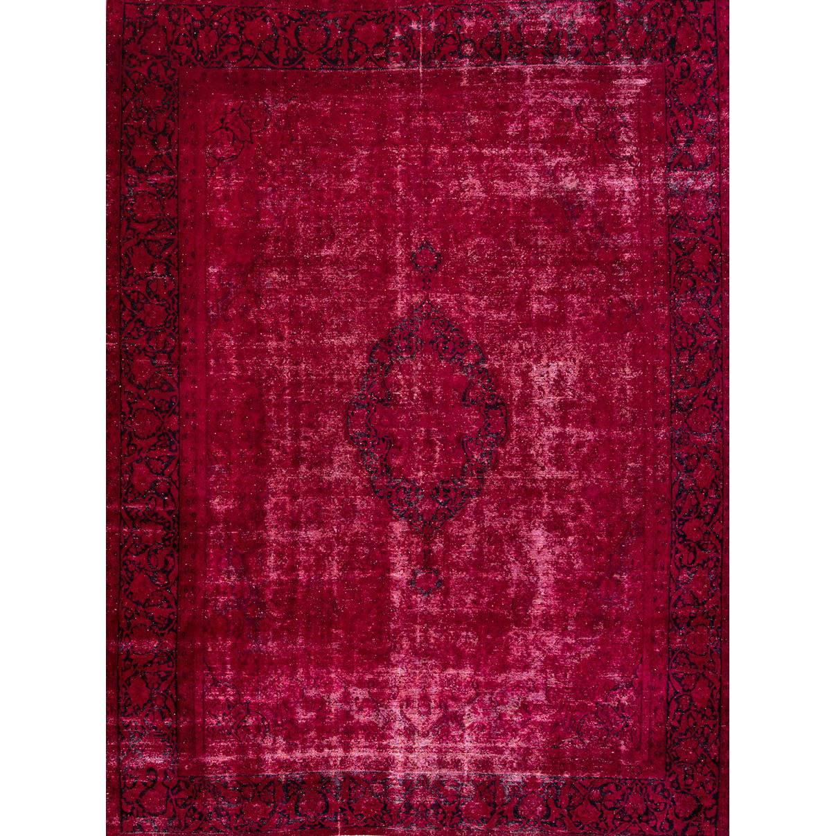 Vintage 1945 Persian overdyed rug. This piece has a field that was dyed dark pink/plum, and has a visible border details and a medallion in the center. Measures 9.04x12.07.