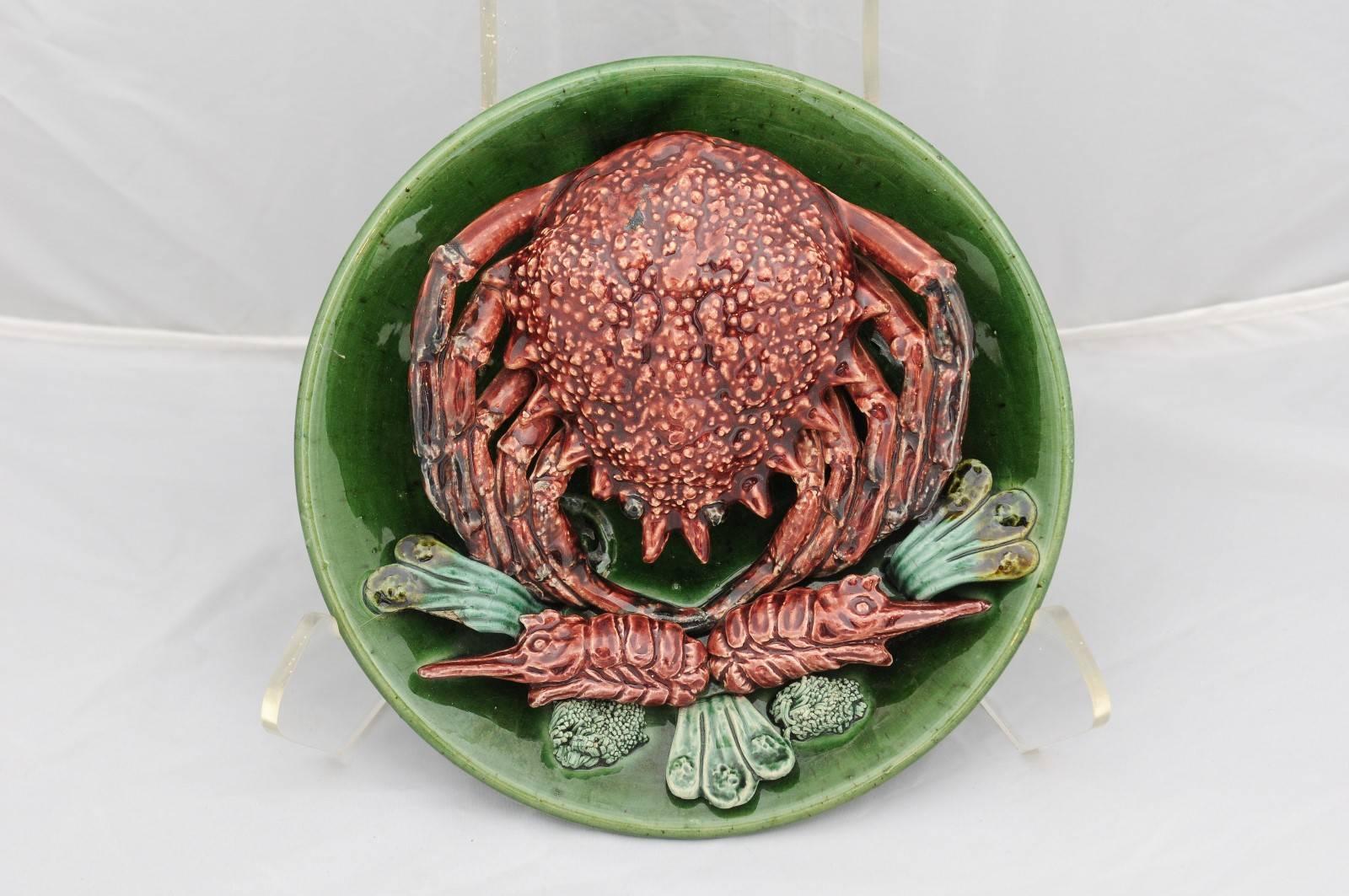 A majolica plate with Palissy style sea spider from the mid 20th century. This Portuguese majolica was made in the manner of Bernard Palissy, a French Renaissance craftsman who worked at the Court of King Henri II and Queen Catherine de Médicis in