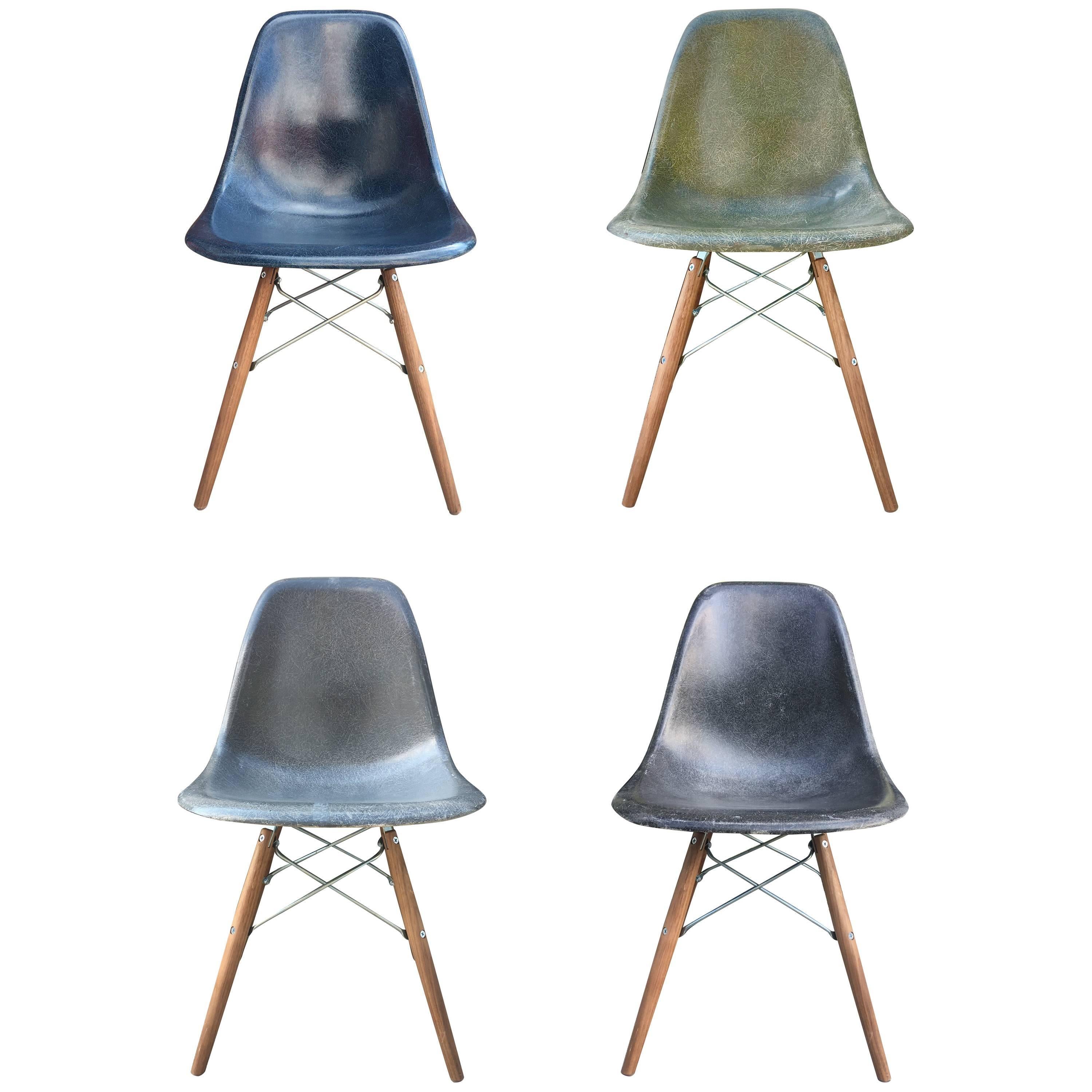 Four Multicolored Eames Dining Chairs